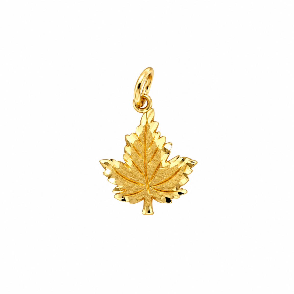 A 10K yellow gold leaf charm with a bail on a white background