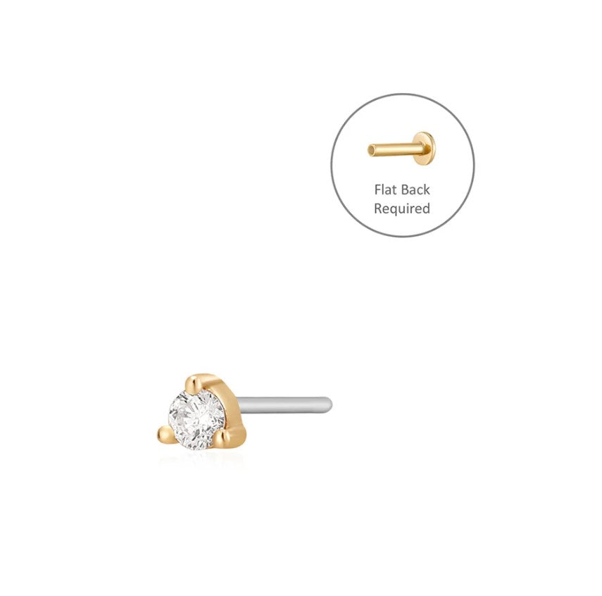 single prong diamond stud with a flat back on white background