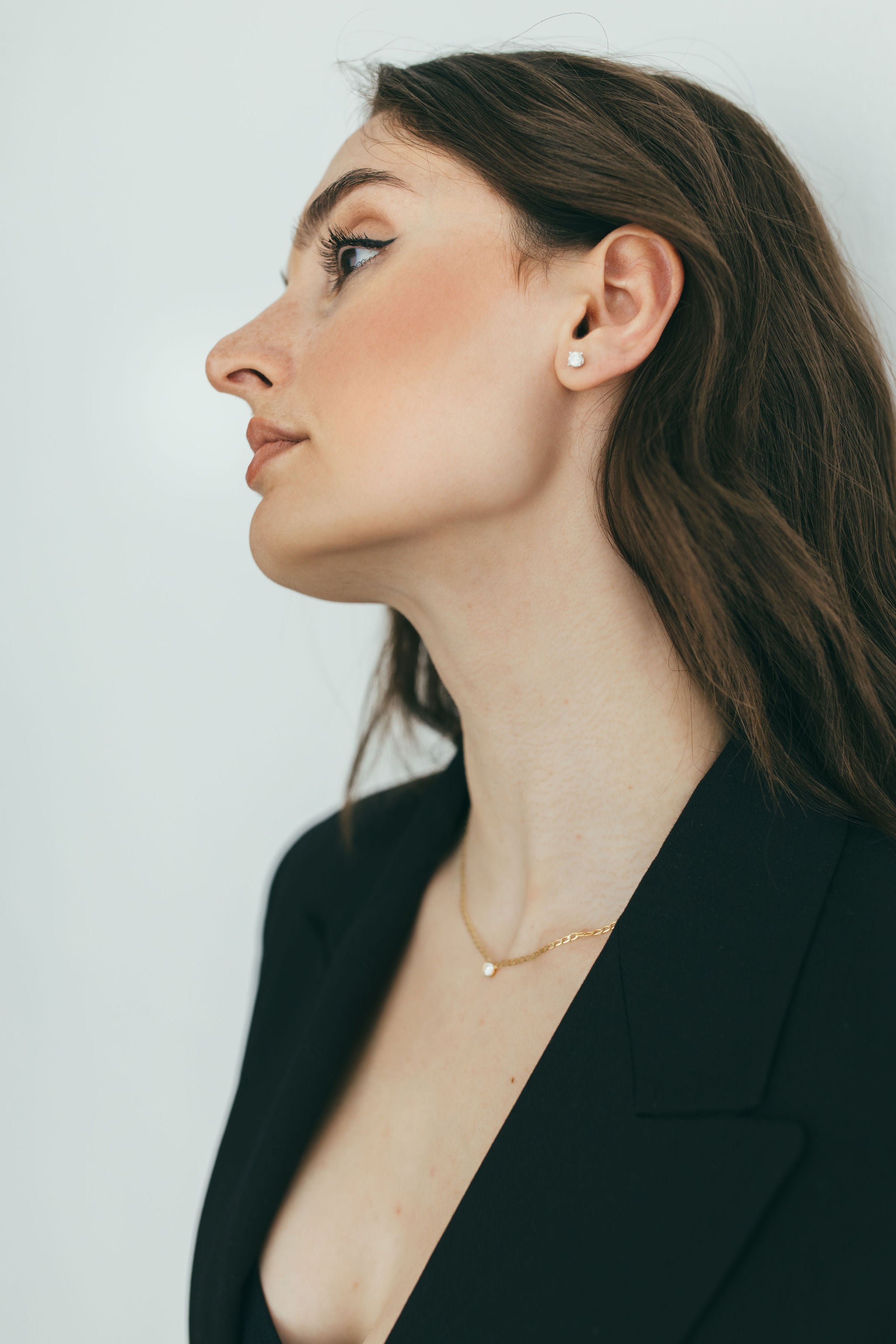 lifestyle shot of a girl wearing lab grown diamond studs