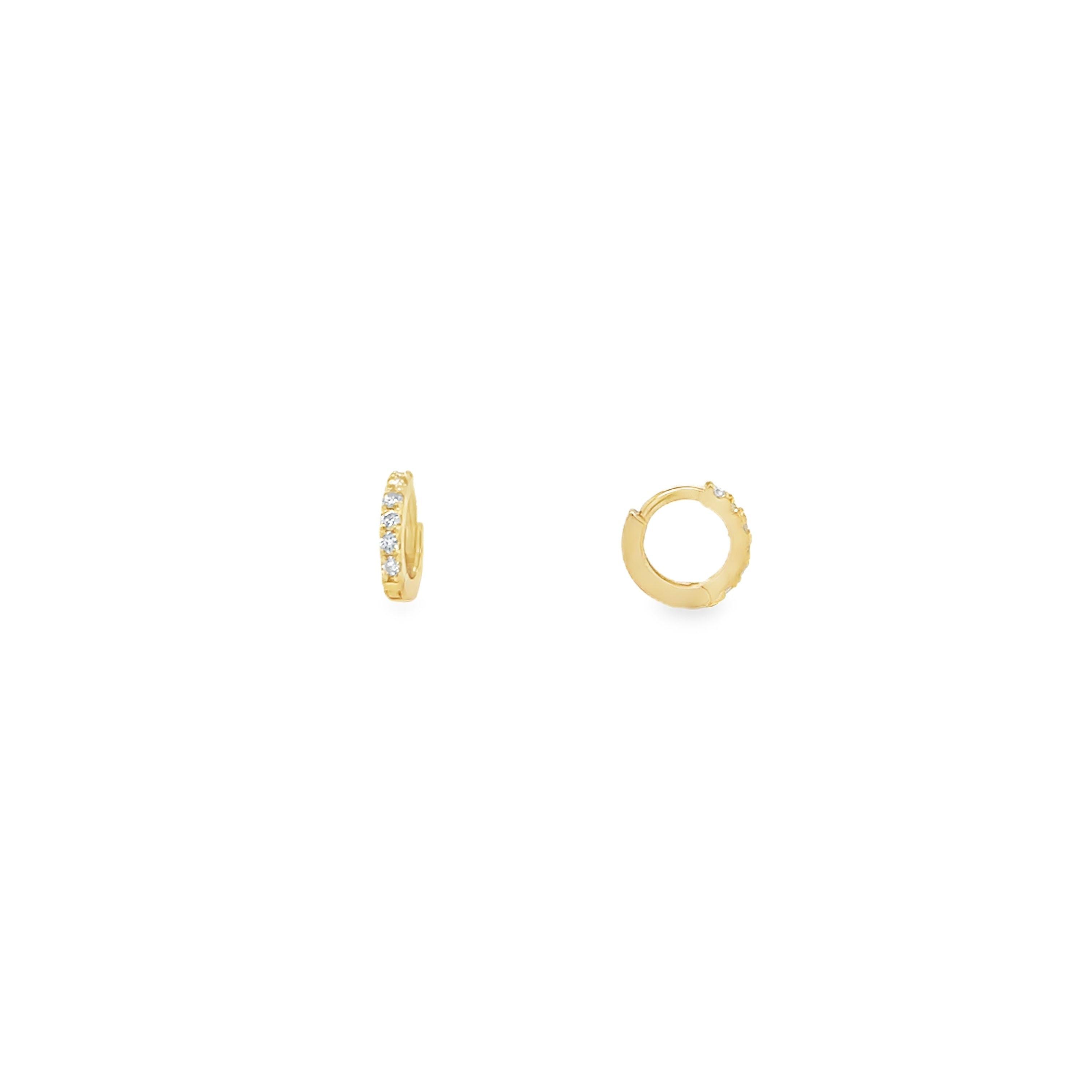 A pair of 14K gold mini huggie earrings with round brilliant cut diamonds