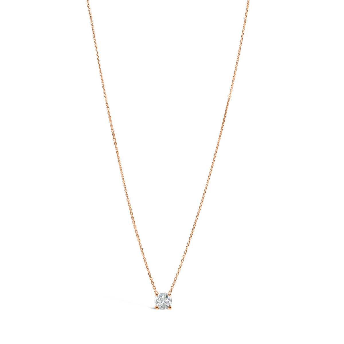 A 14K gold necklace with a single diamond that appears to float on the chain, showcasing its brilliance and sparkle.