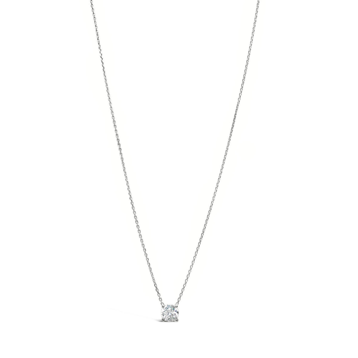 A 14K gold necklace with a single diamond that appears to float on the chain, showcasing its brilliance and sparkle.