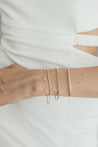 Jessica Jewellery's Petite Pearl Bracelet displayed elegantly on a marble background.