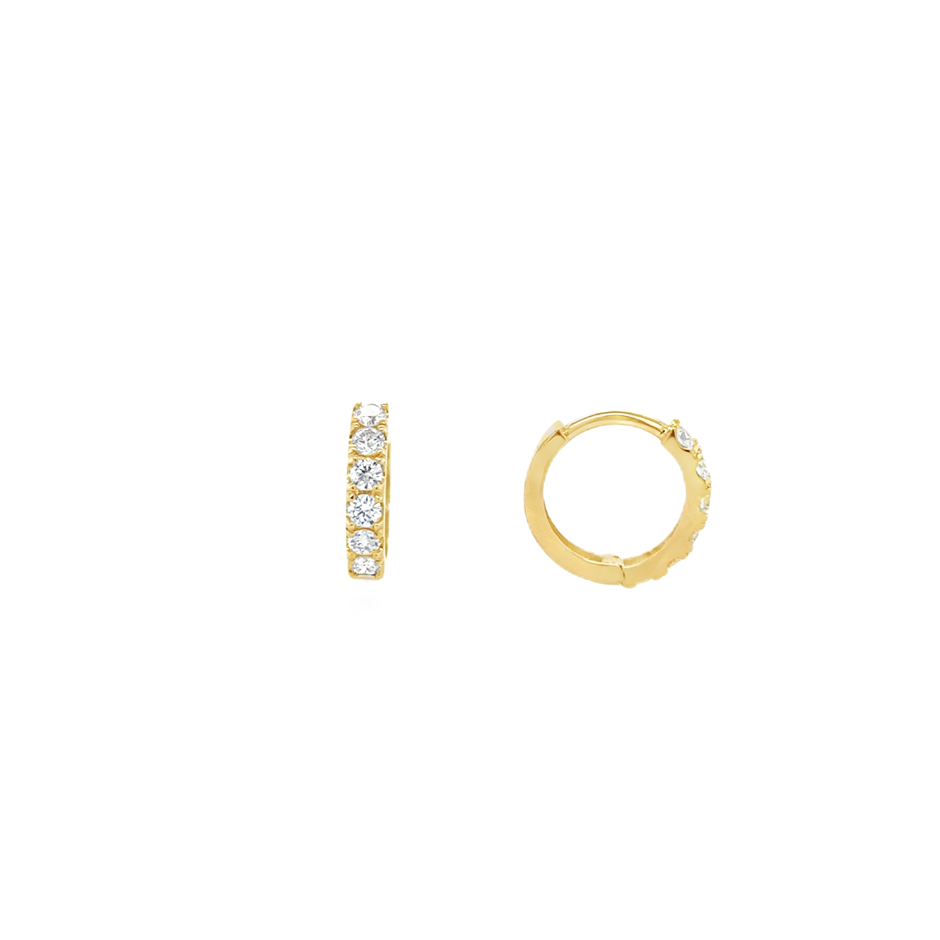 A pair of medium-sized gold huggie earrings with lab grown diamonds set in a circular pattern.