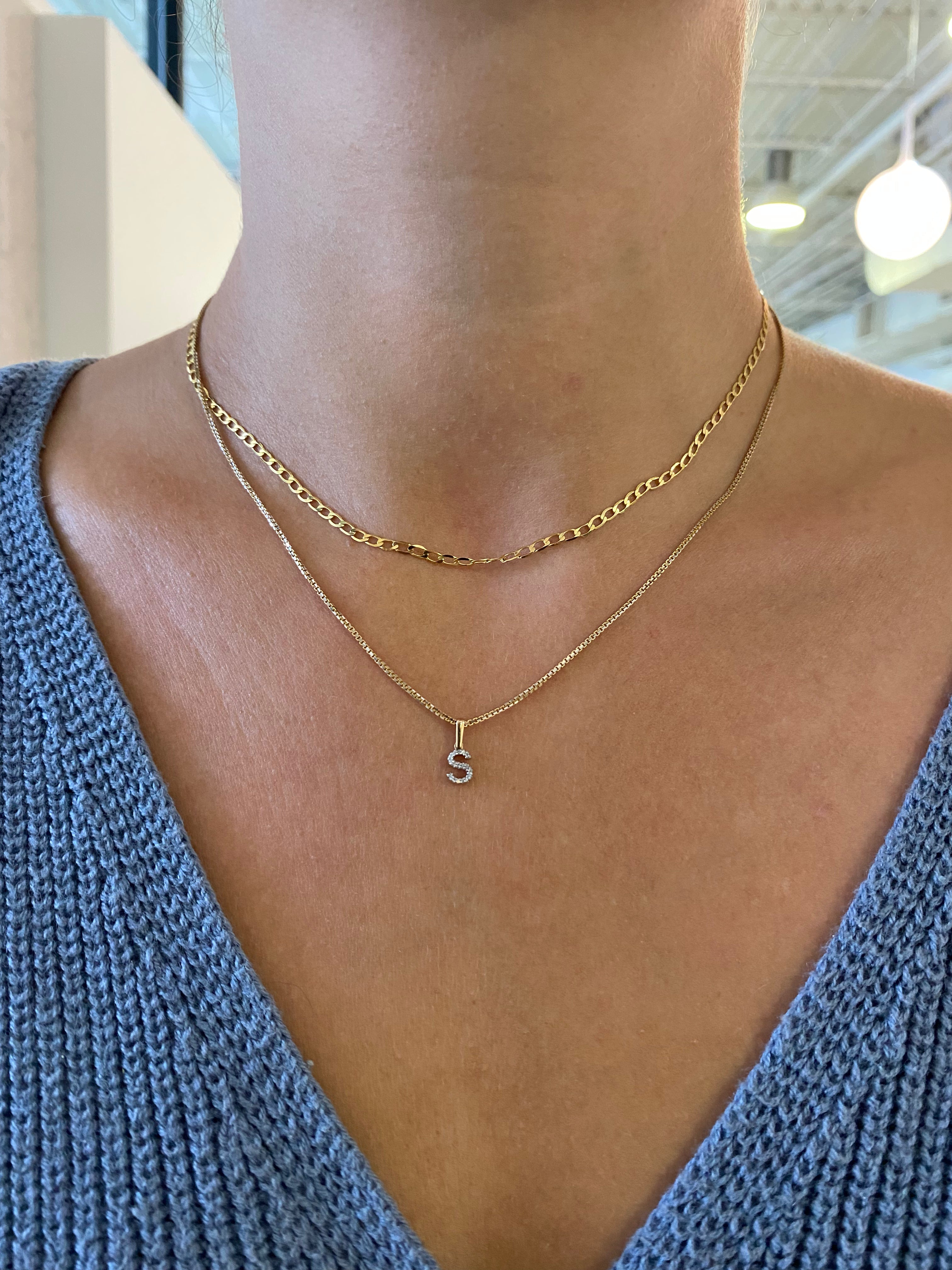 Delicate diamond initial charm, a thoughtful gift from Jessica Jewellery.