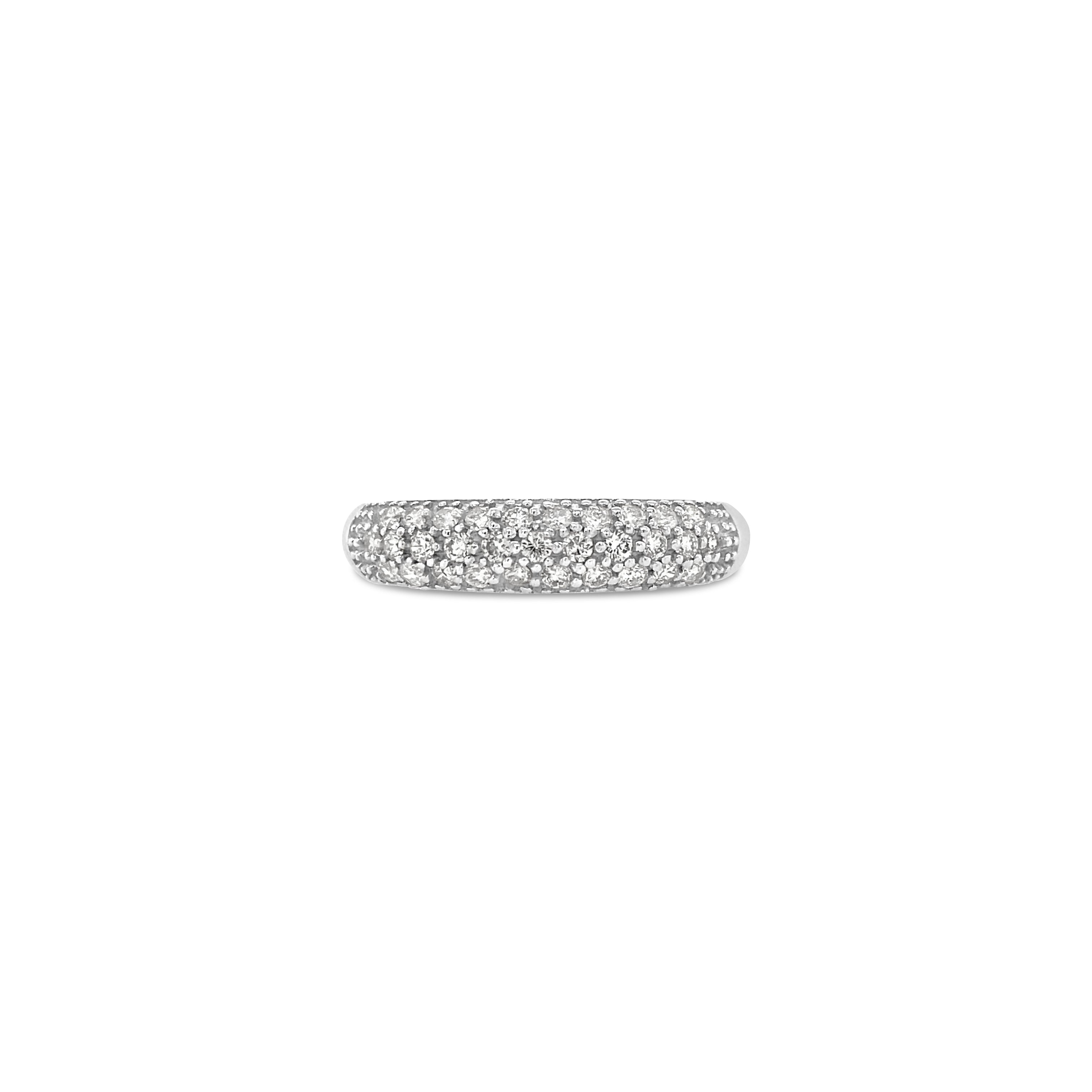A 14K gold diamond dome ring with pavé diamonds set in a white gold band.