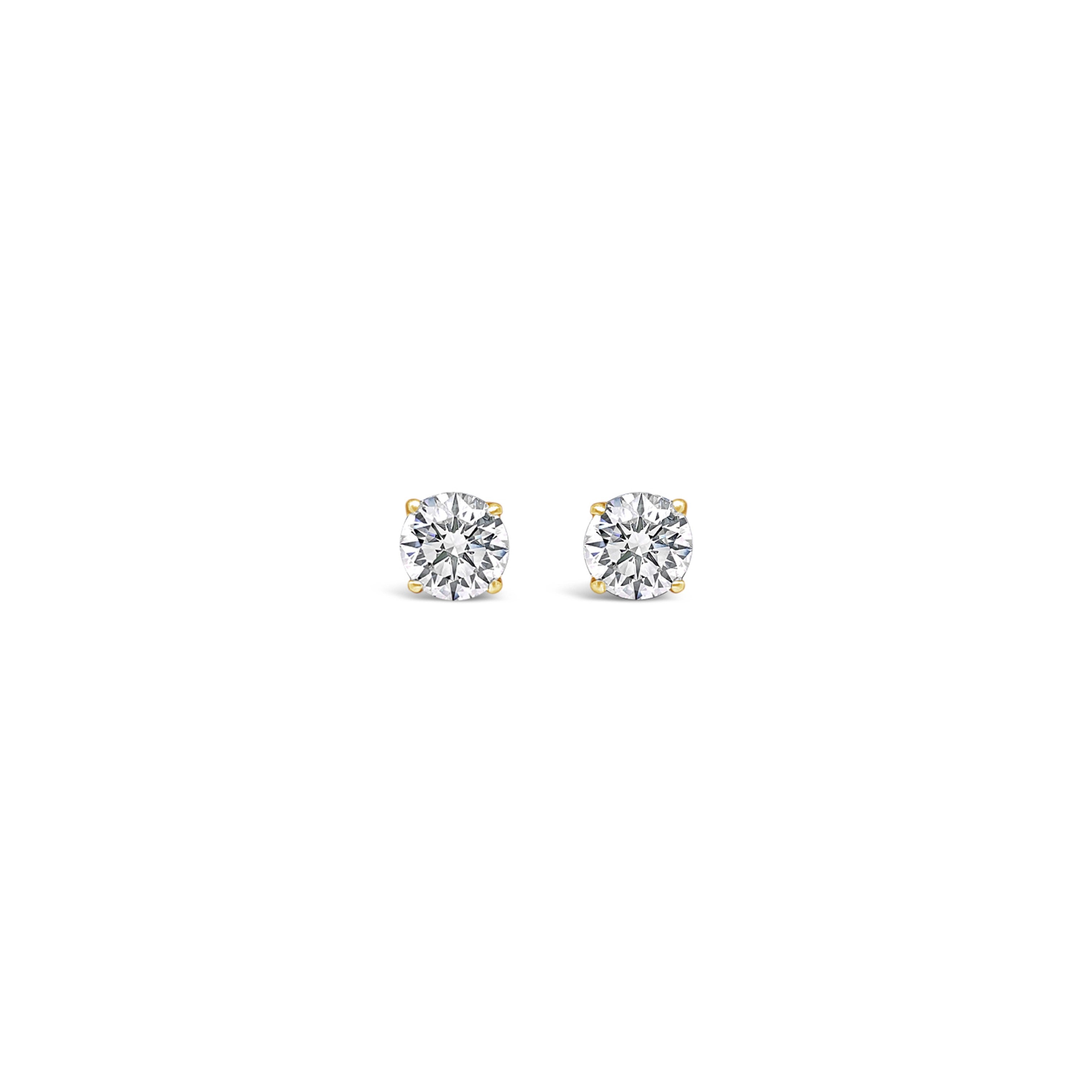 A pair of lab-grown round diamond stud earrings in a double gallery setting