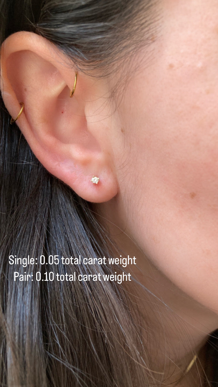 close up of ear wearing a .05 total carat weight diamond stud