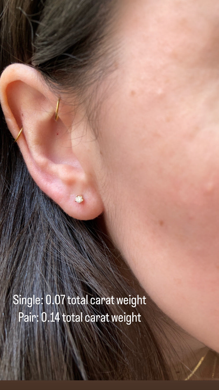 close up of ear wearing a .07 total carat weight diamond stud