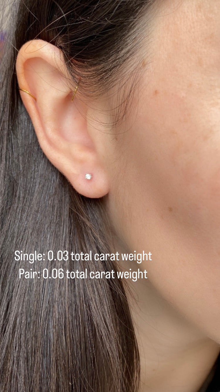 close up of girls ear wearing .03 total carat weight diamond stud