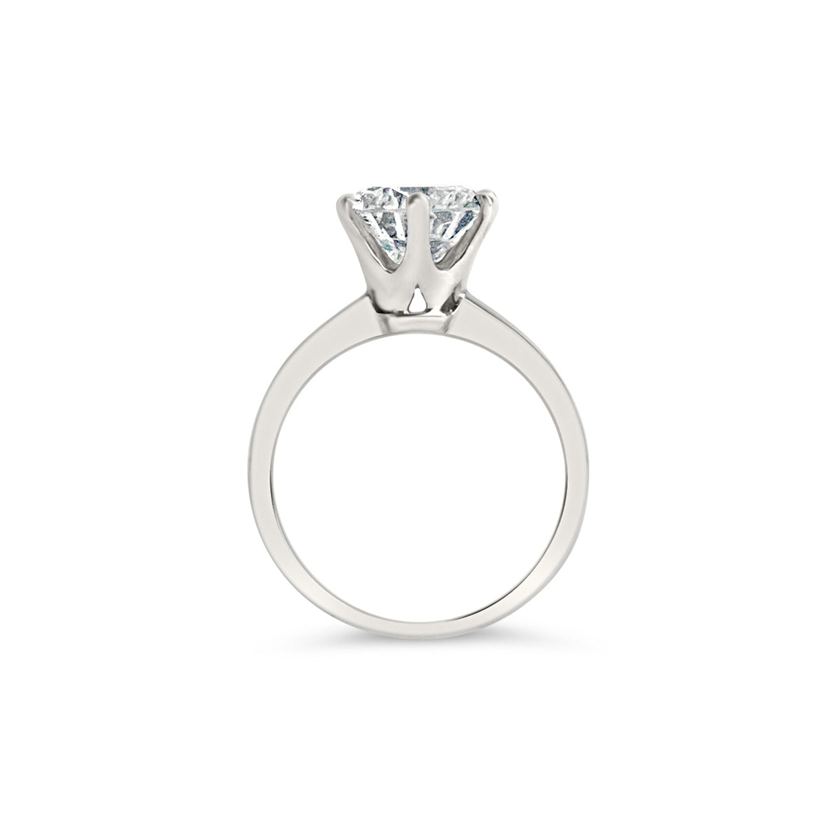 A 6 prong engagement ring with a round center diamond, held by six smaller prongs, in a white gold band.