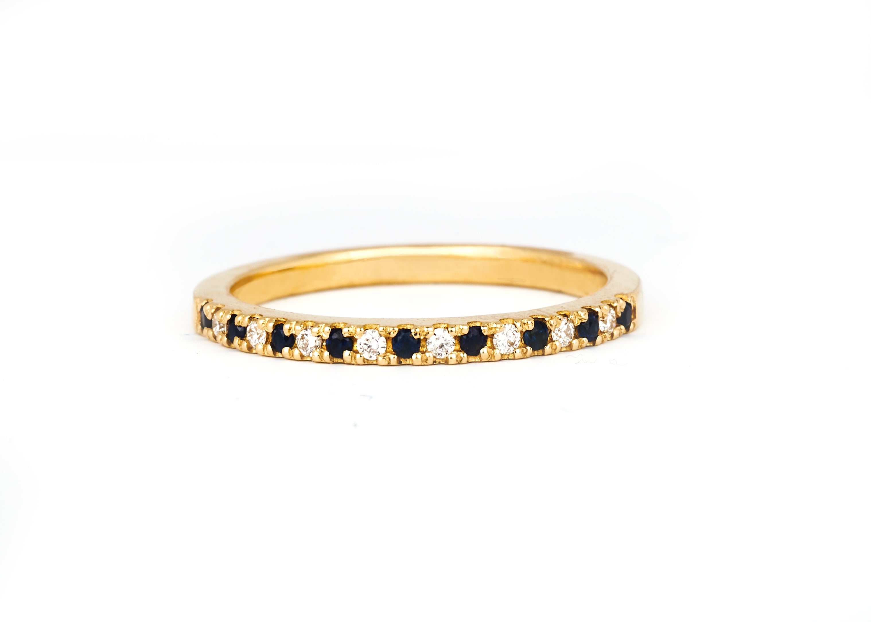 A 1.5mm alternating diamond and birthstone ring against a white background.