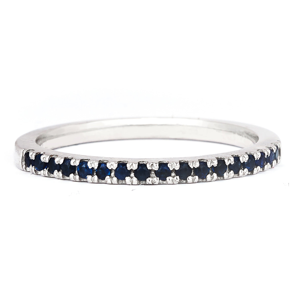 A 1.5mm birthstone and white gold ring against a white background.