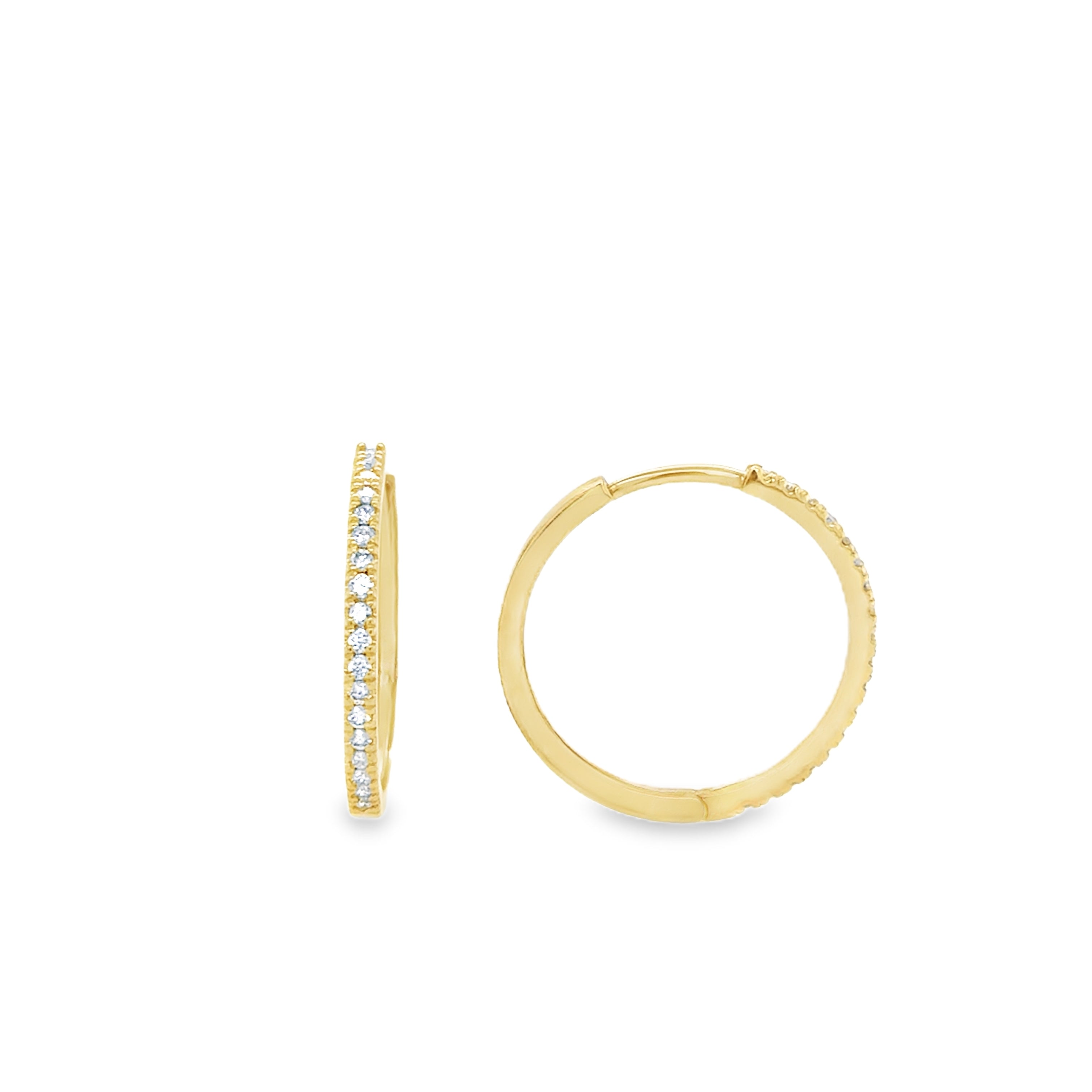 A pair of gold hoop earrings with lab grown diamonds set around the edge, displayed against a white background.