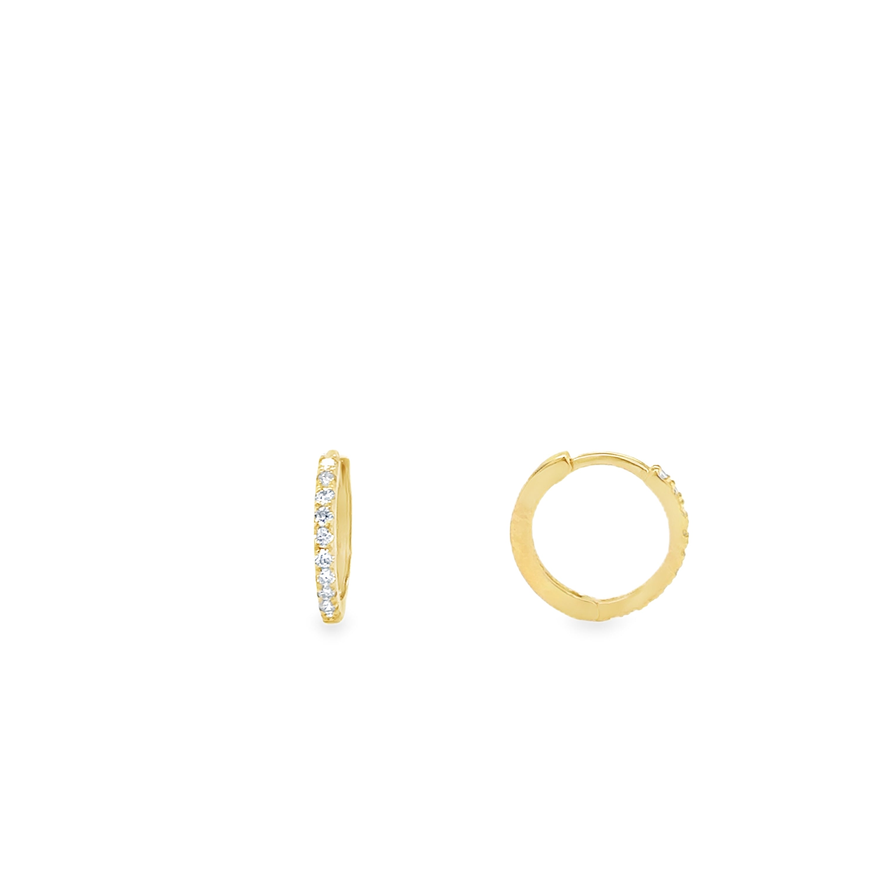 A pair of lab grown mini diamond huggies earrings set in 10 karat gold.