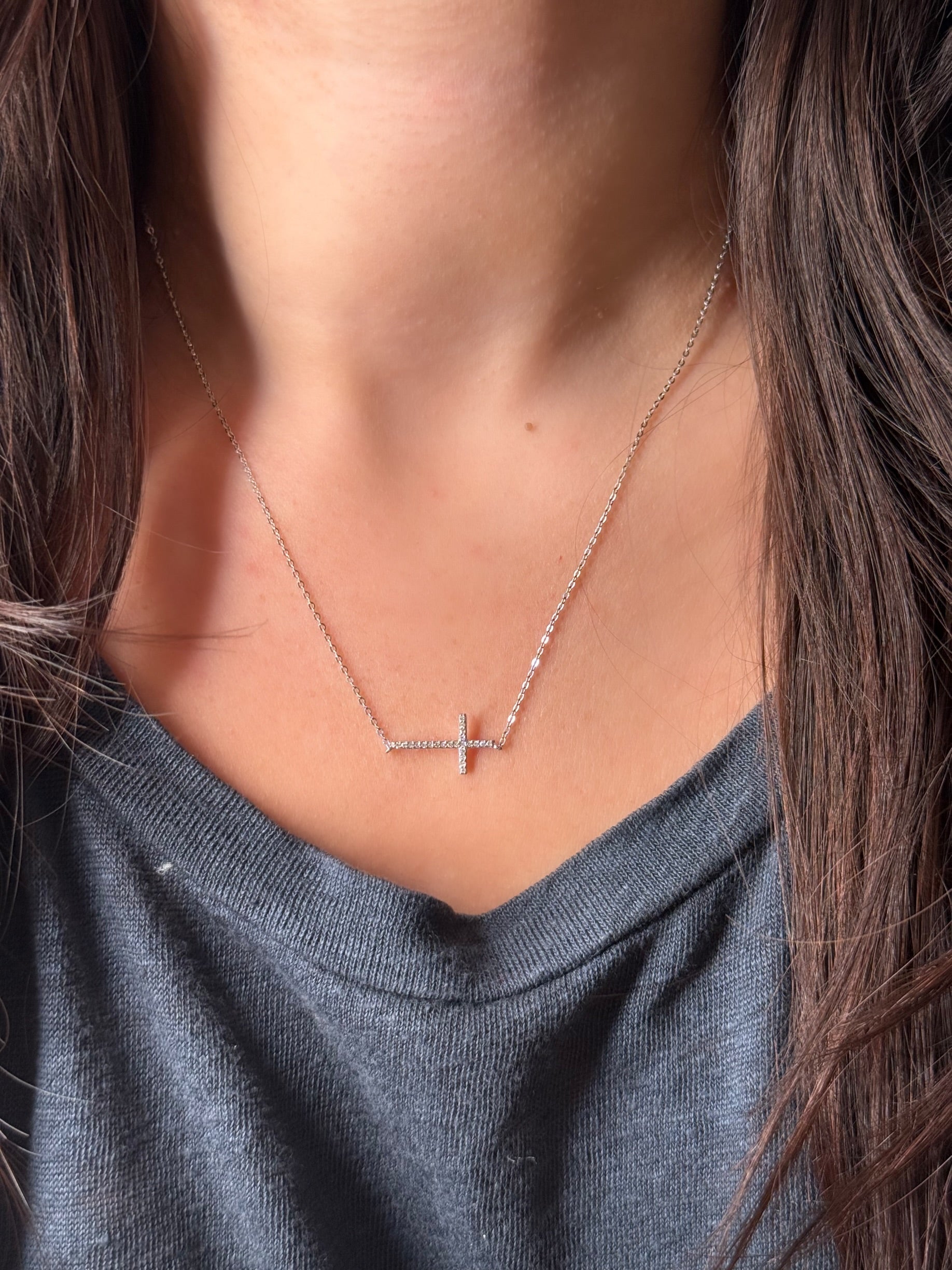 Diamond Cross Necklace worn on a model.