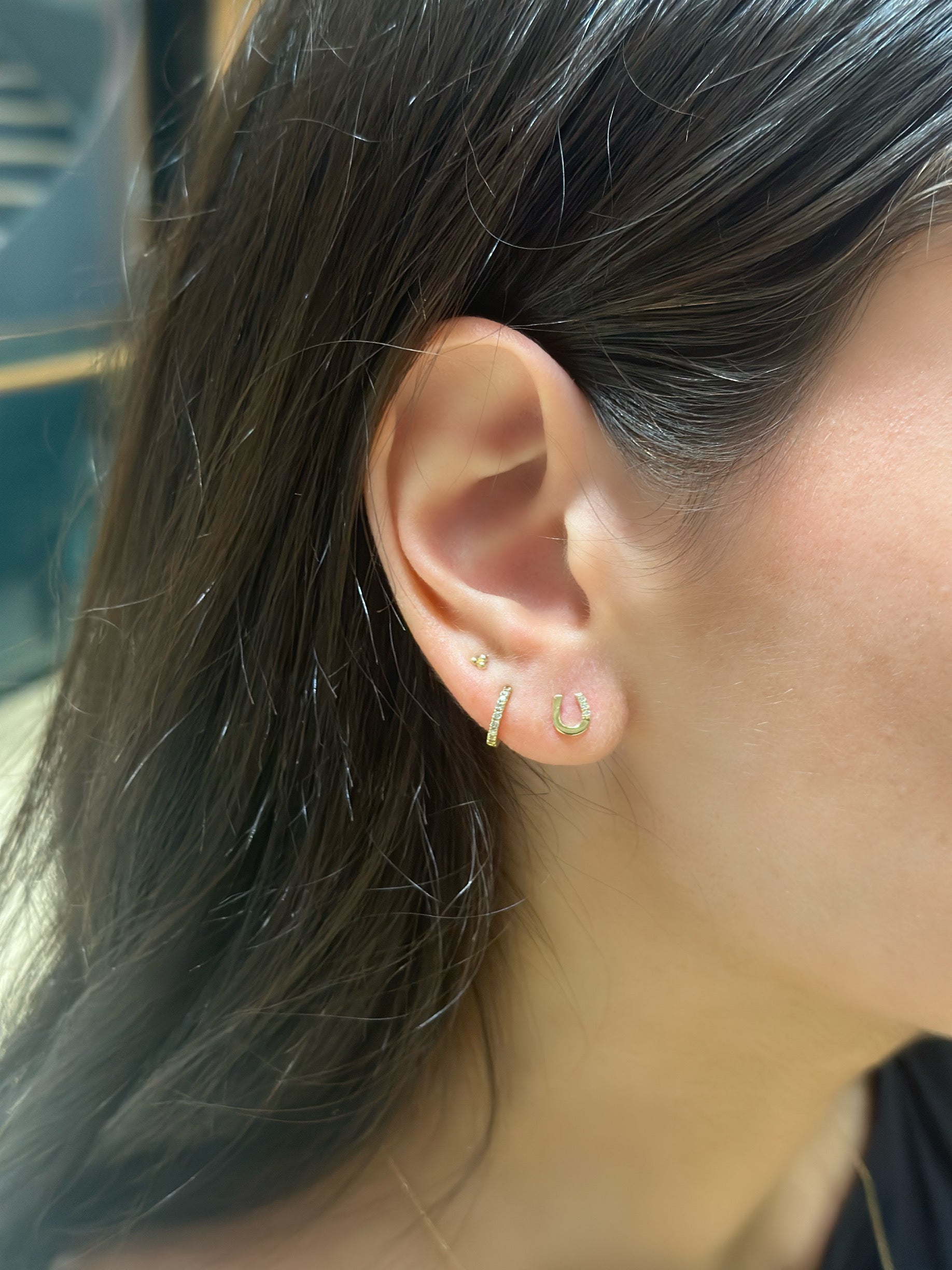 earring stack of gold and diamond earrings