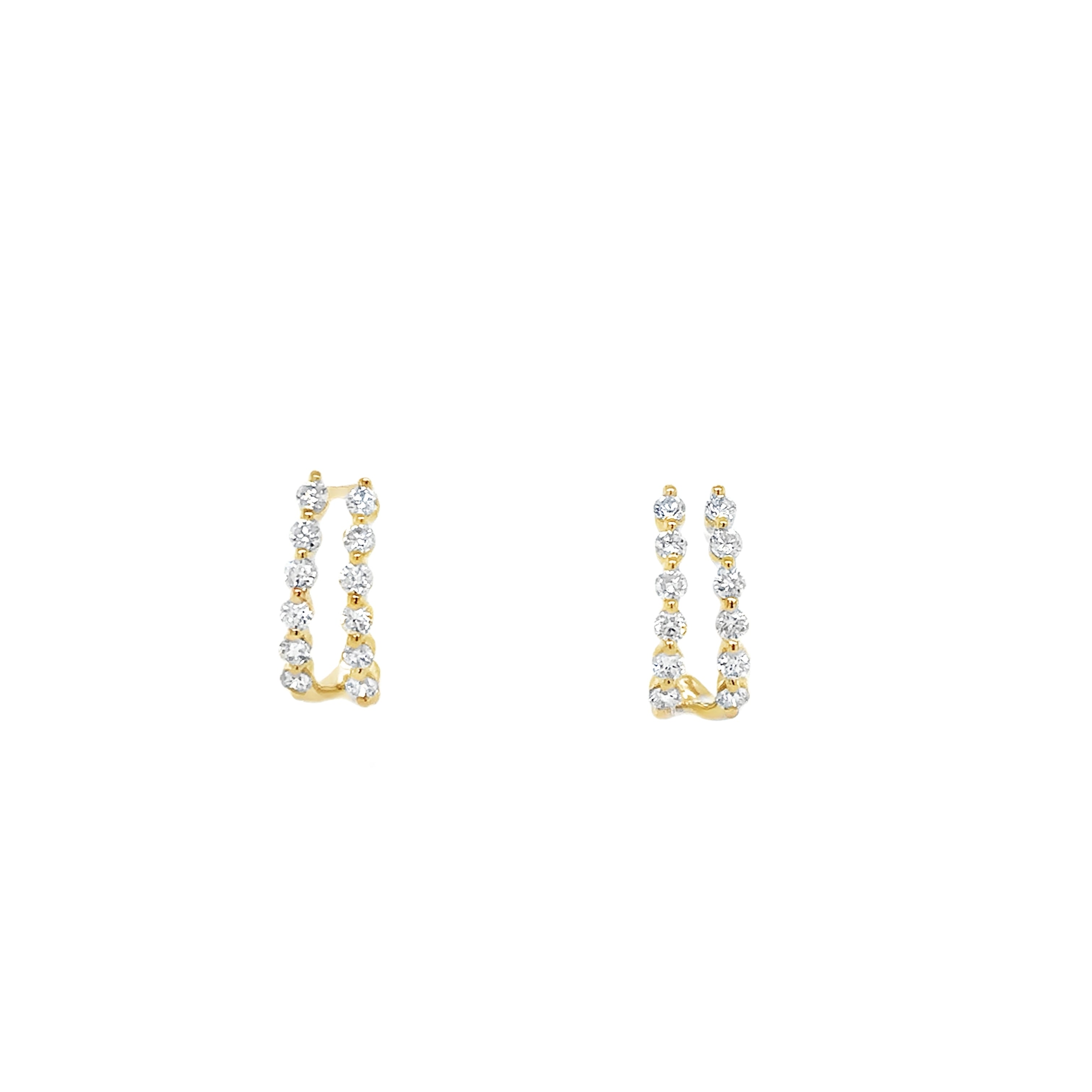 A pair of 14K yellow gold double diamond huggie earrings with a single prong setting.