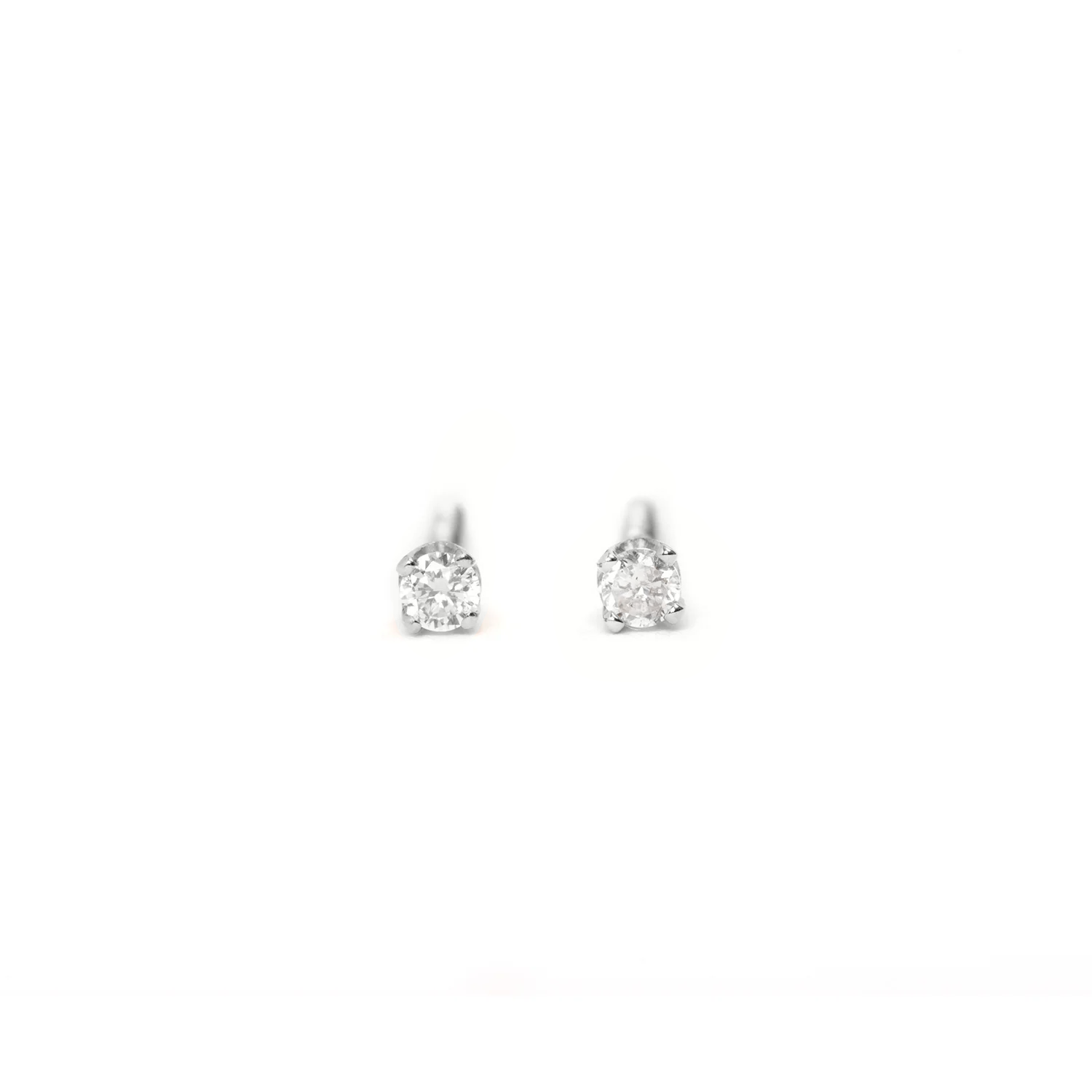 white gold screw back diamond studs on a white background 
