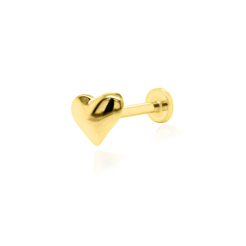 Gold heart-shaped earring on a white background