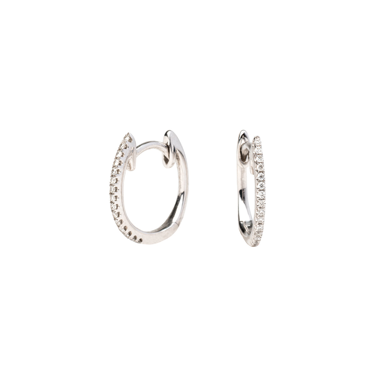 white gold pave huggies on a white backround