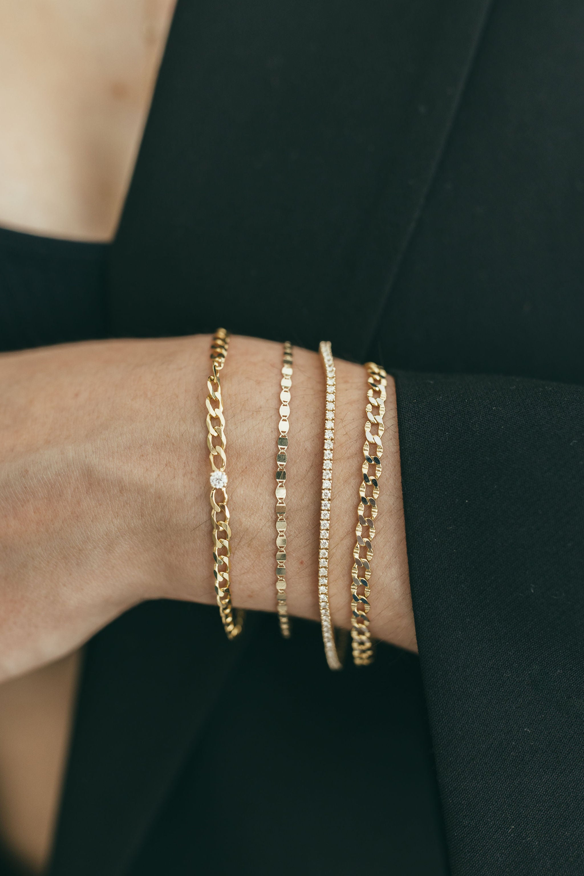 Detail view of the Flat Mirror Chain Bracelet highlighting its polished surface.