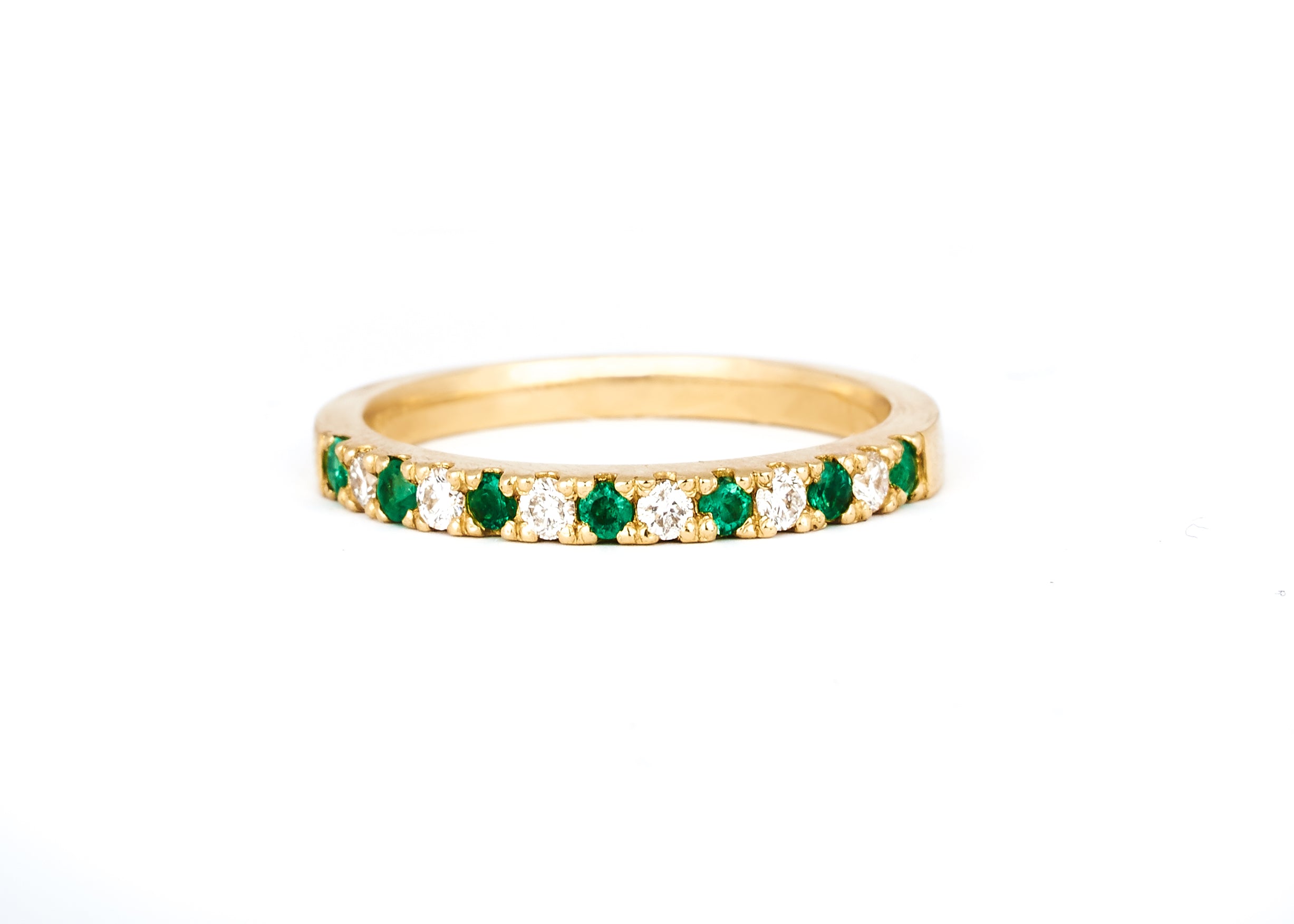 A 2mm alternating diamond and birthstone ring against a white background.