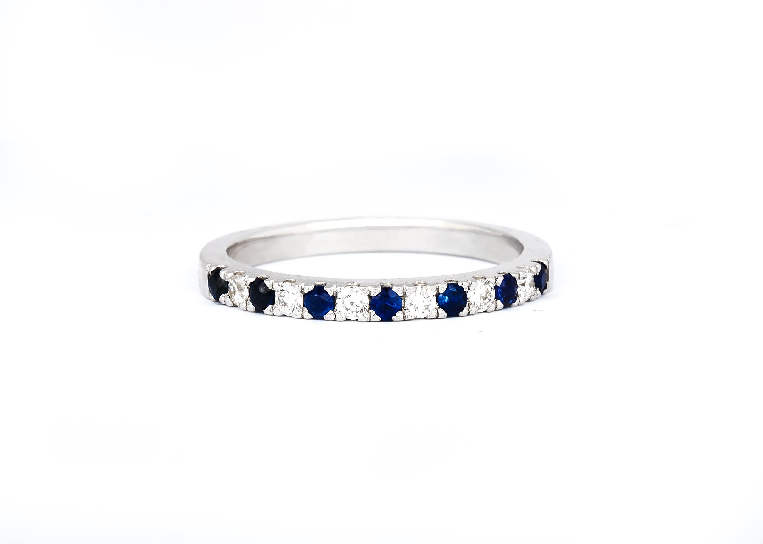 A 2mm alternating diamond and birthstone ring against a white background.