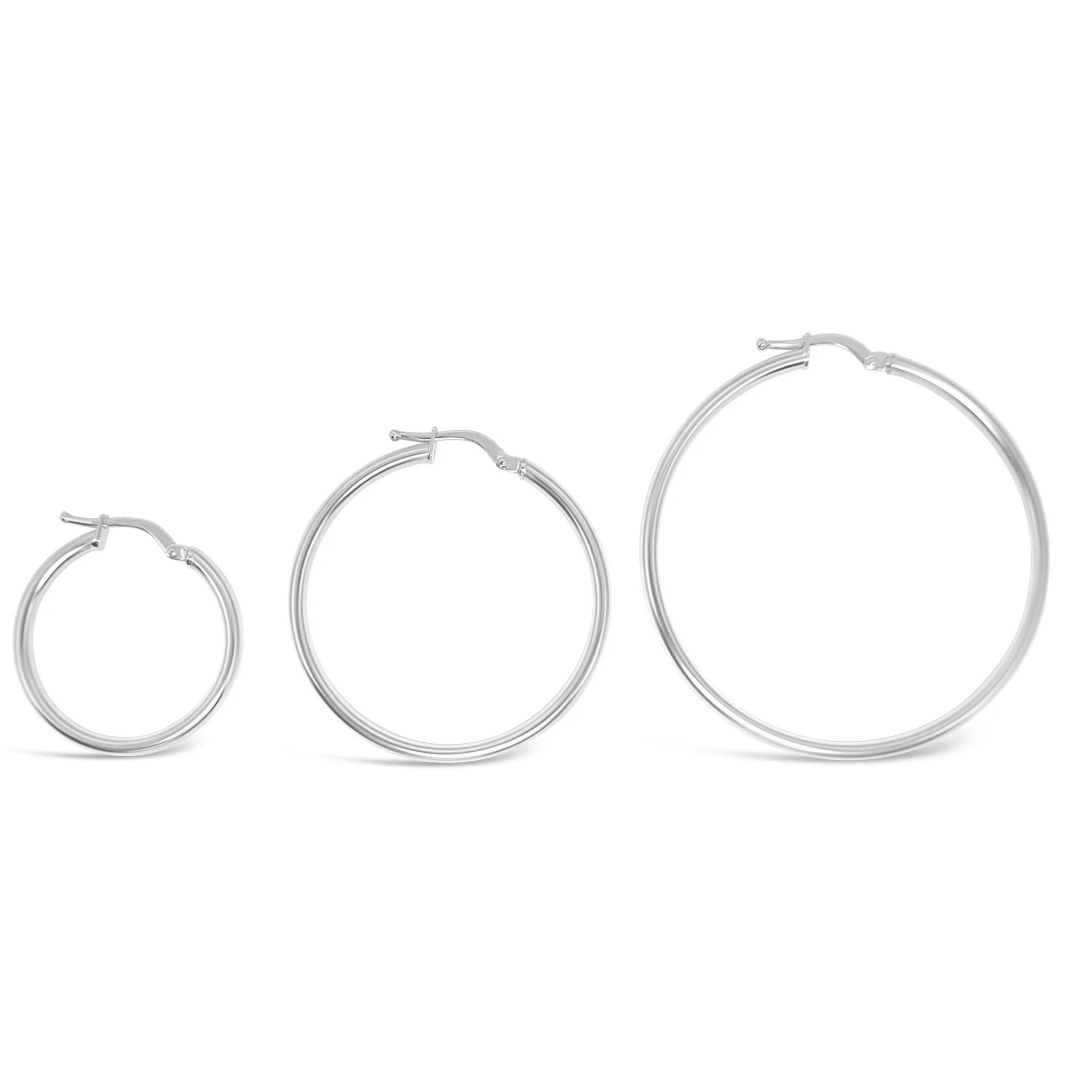white gold hoops in three different sizes  on a white background 