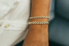 Puffy curb bracelet with diamond cuts, ideal for jewelry layering.