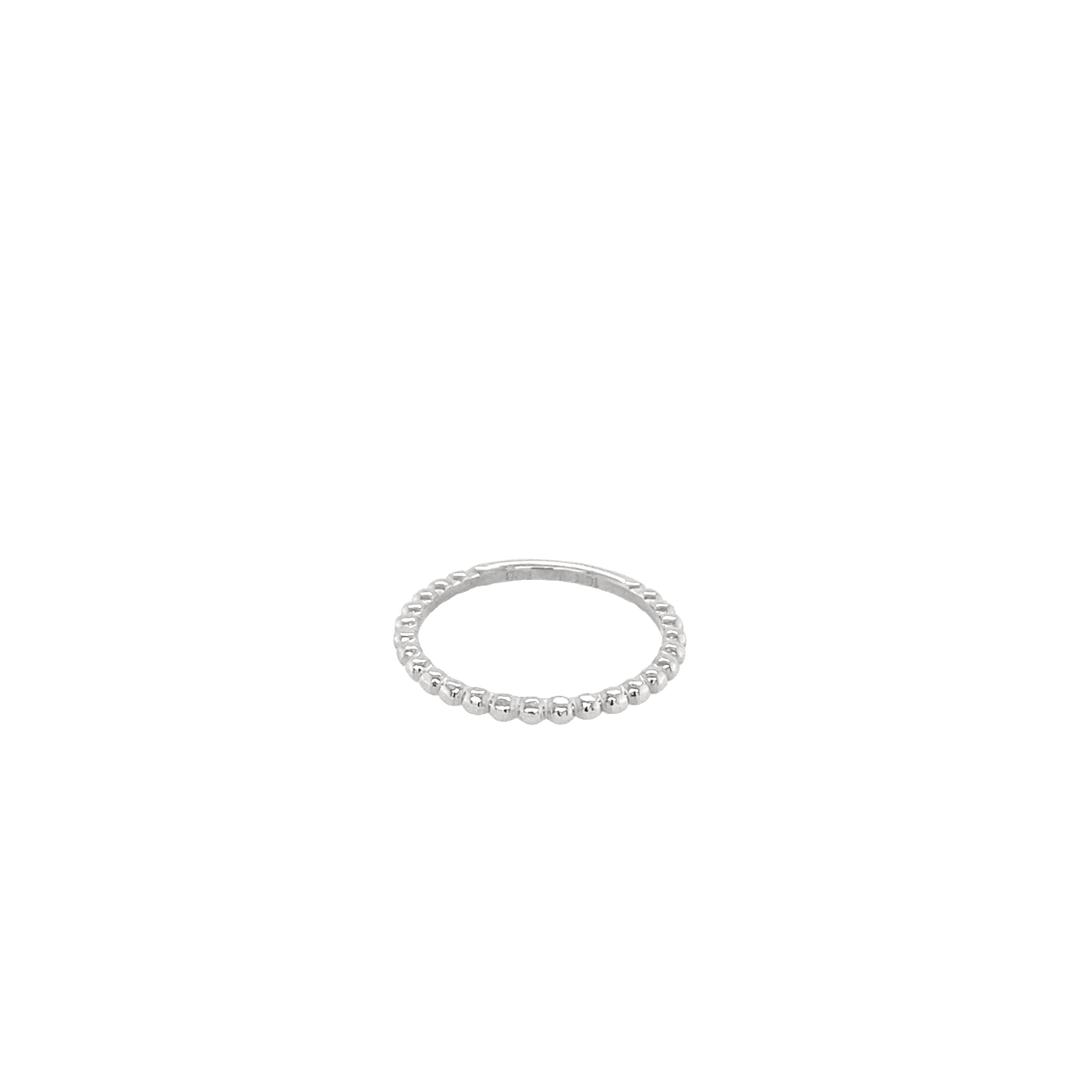 A white gold bead ring on a white background.