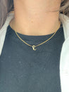 Elegant and bold Gothic Initial Necklace worn alone for a statement look.