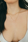Close-up of the delicate diamond bezel station necklace by Jessica Jewellery.