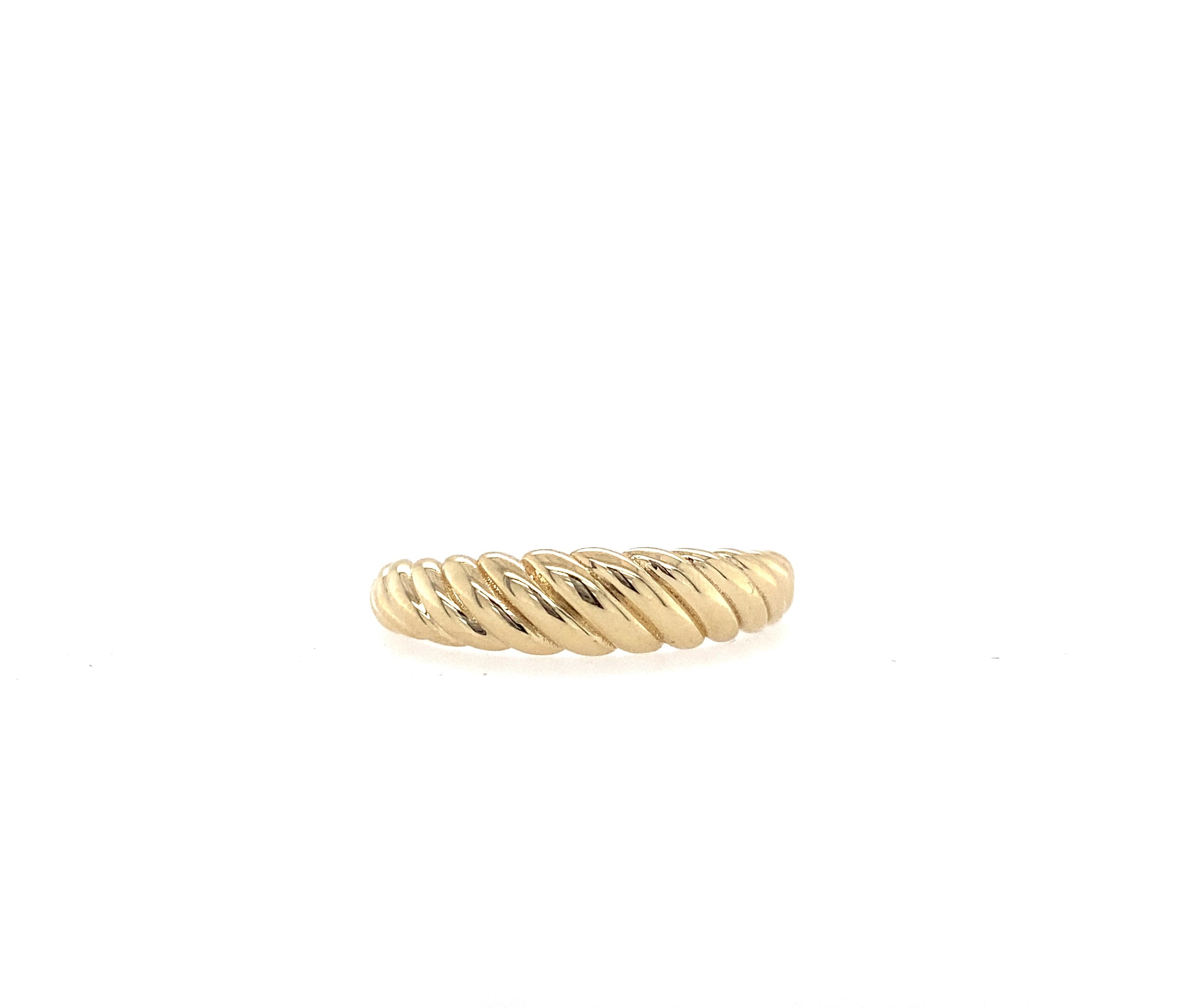 A yellow gold croissant ring on a white background.