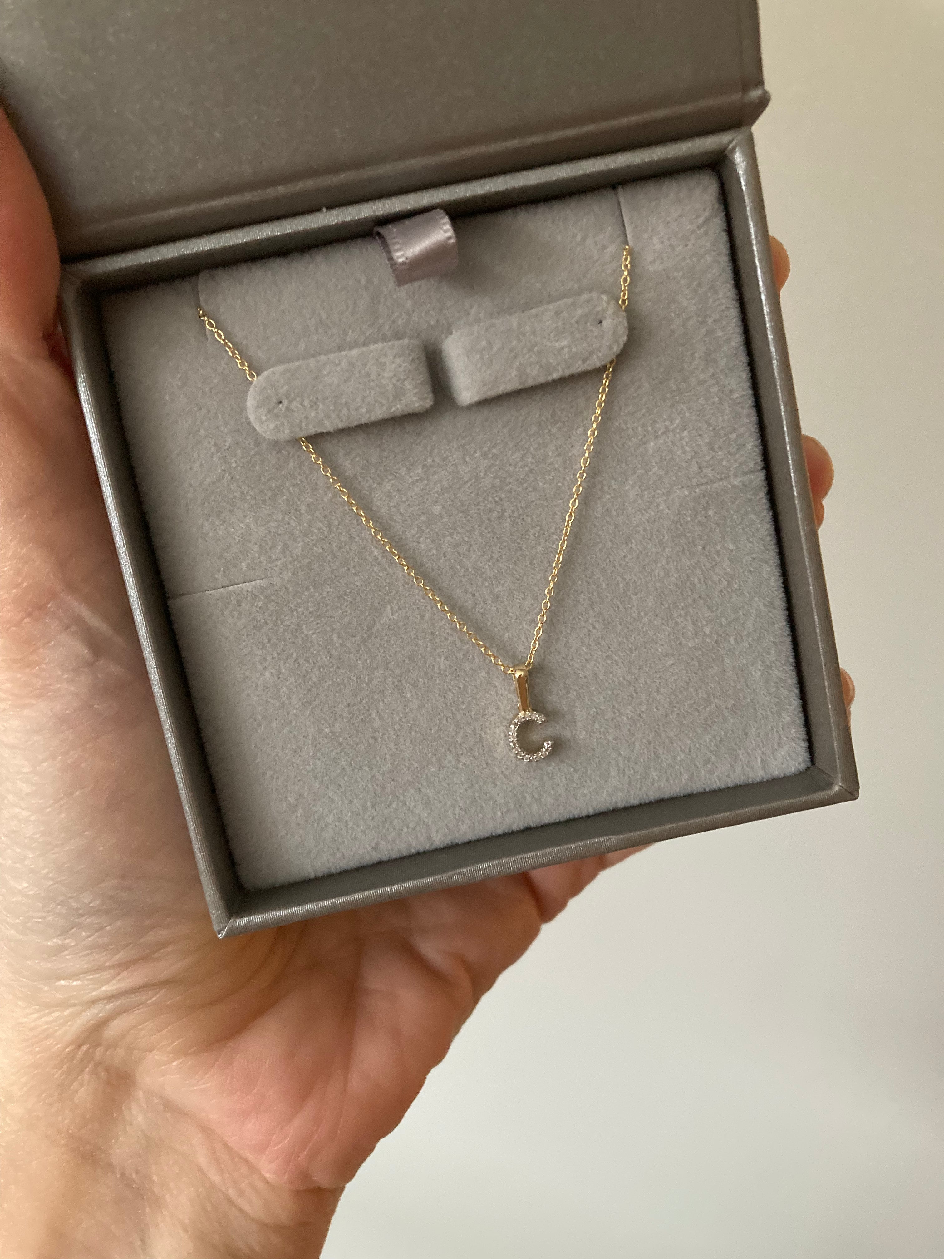 Luxurious diamond initial charm by Jessica Jewellery, perfect for layering.