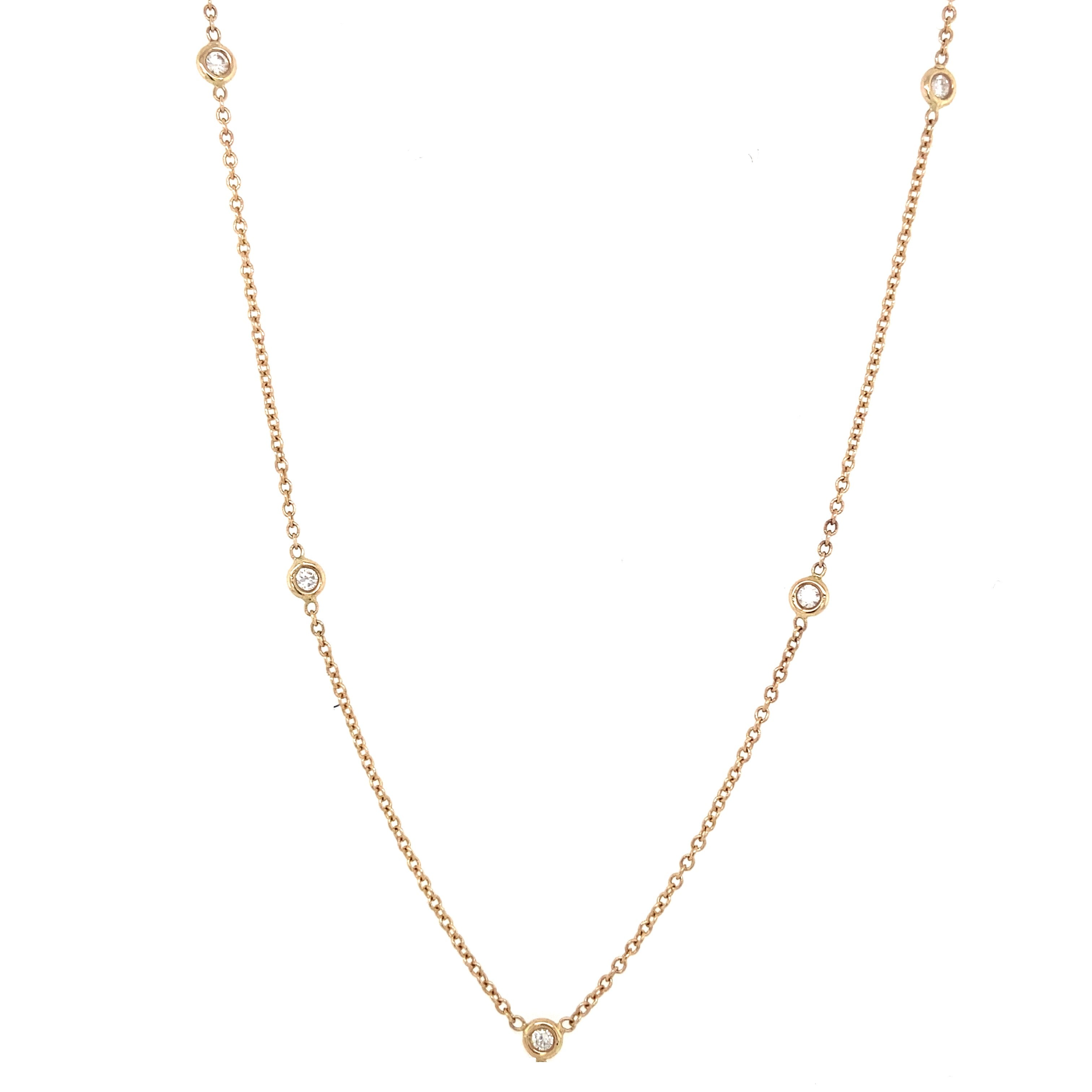 Jessica Jewellery's diamond bezel station necklace glinting in natural light.