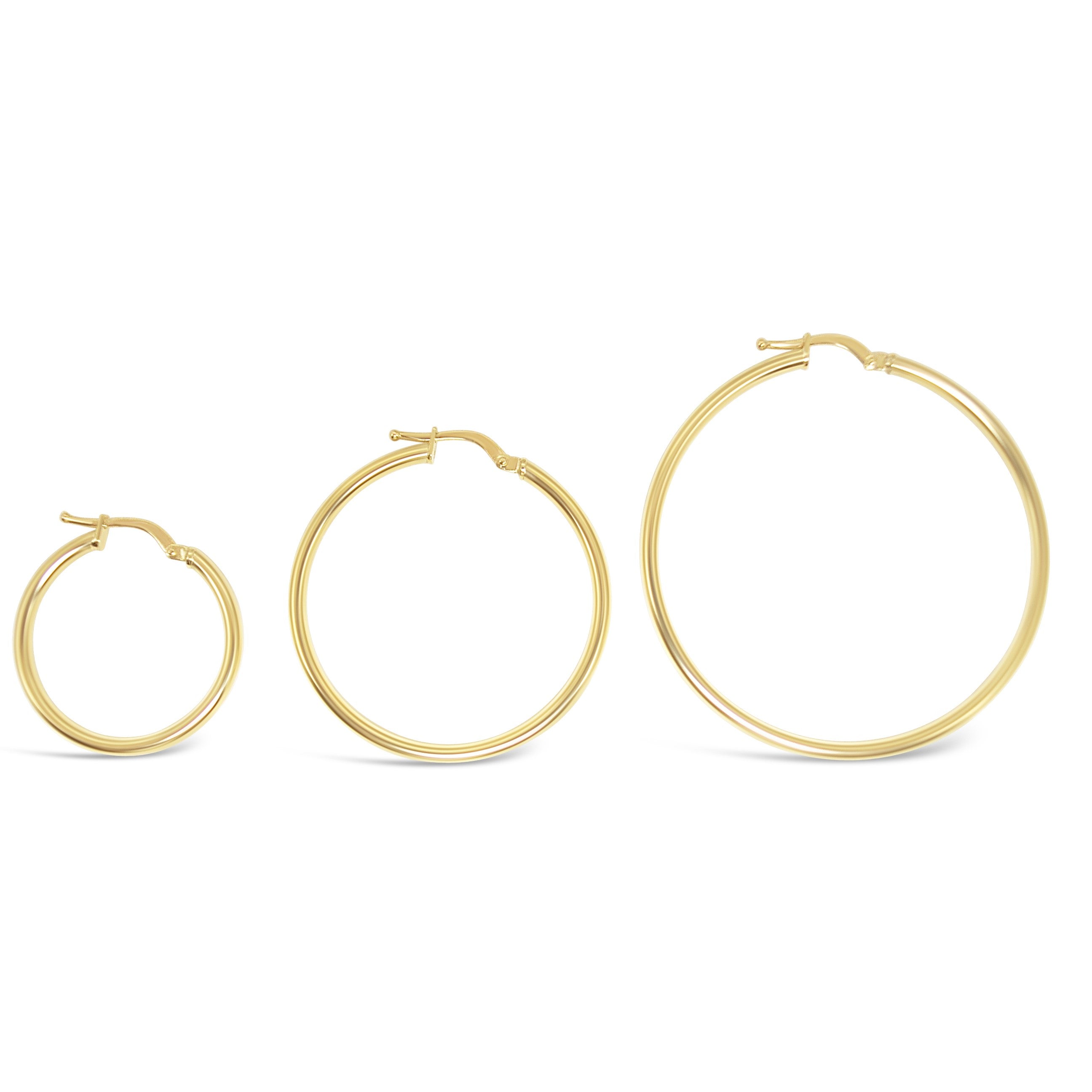 A collection of gold hoop earrings in various sizes, displayed side by side.