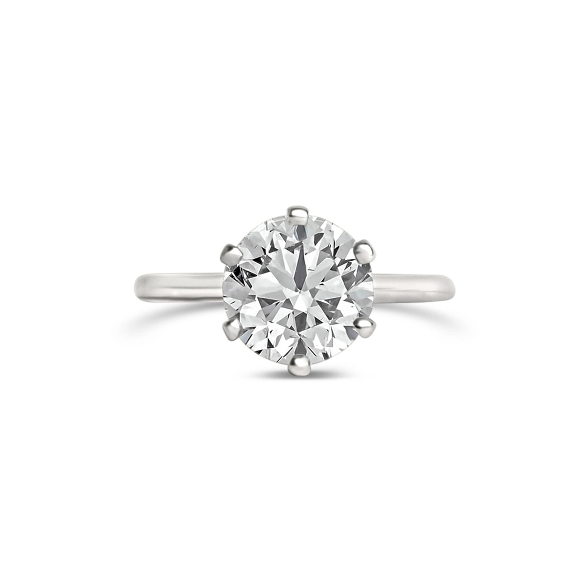 A 6 prong engagement ring with a round center diamond, held by six smaller prongs, in a white gold band.