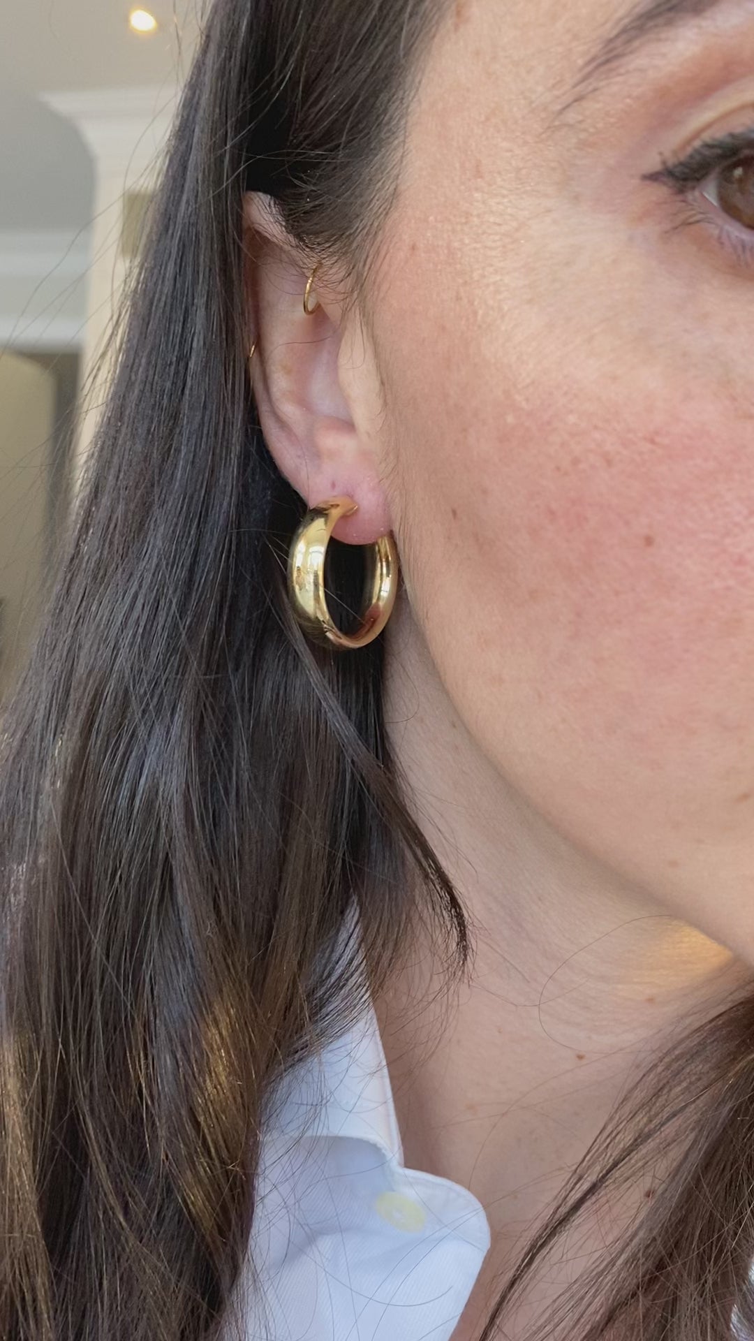Lifestyle video of extra thick hoops being worn, perfect for adding a bold touch to any outfit.