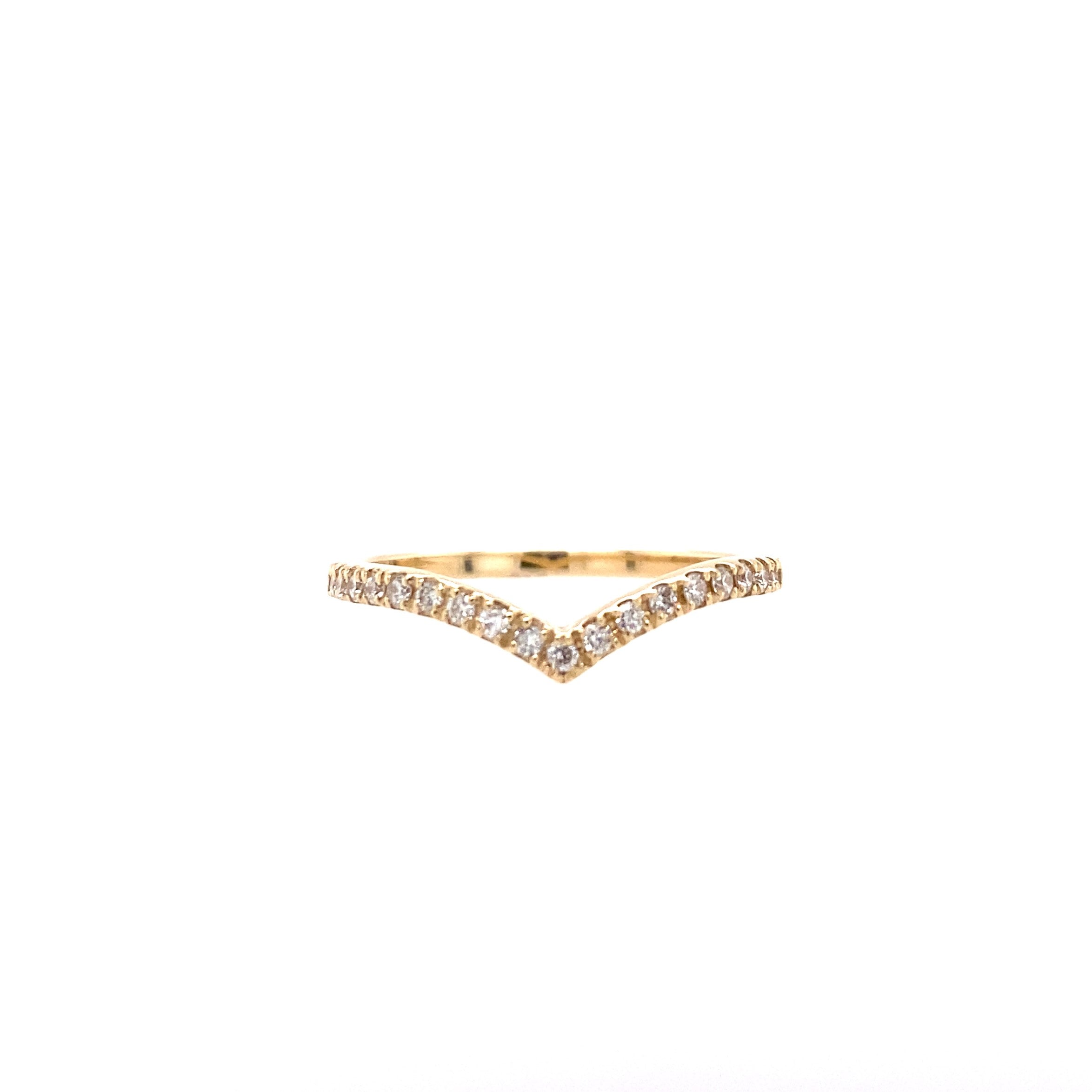 A diamond V-shaped ring with a band of smaller diamonds set in a yellow gold band against a white background.