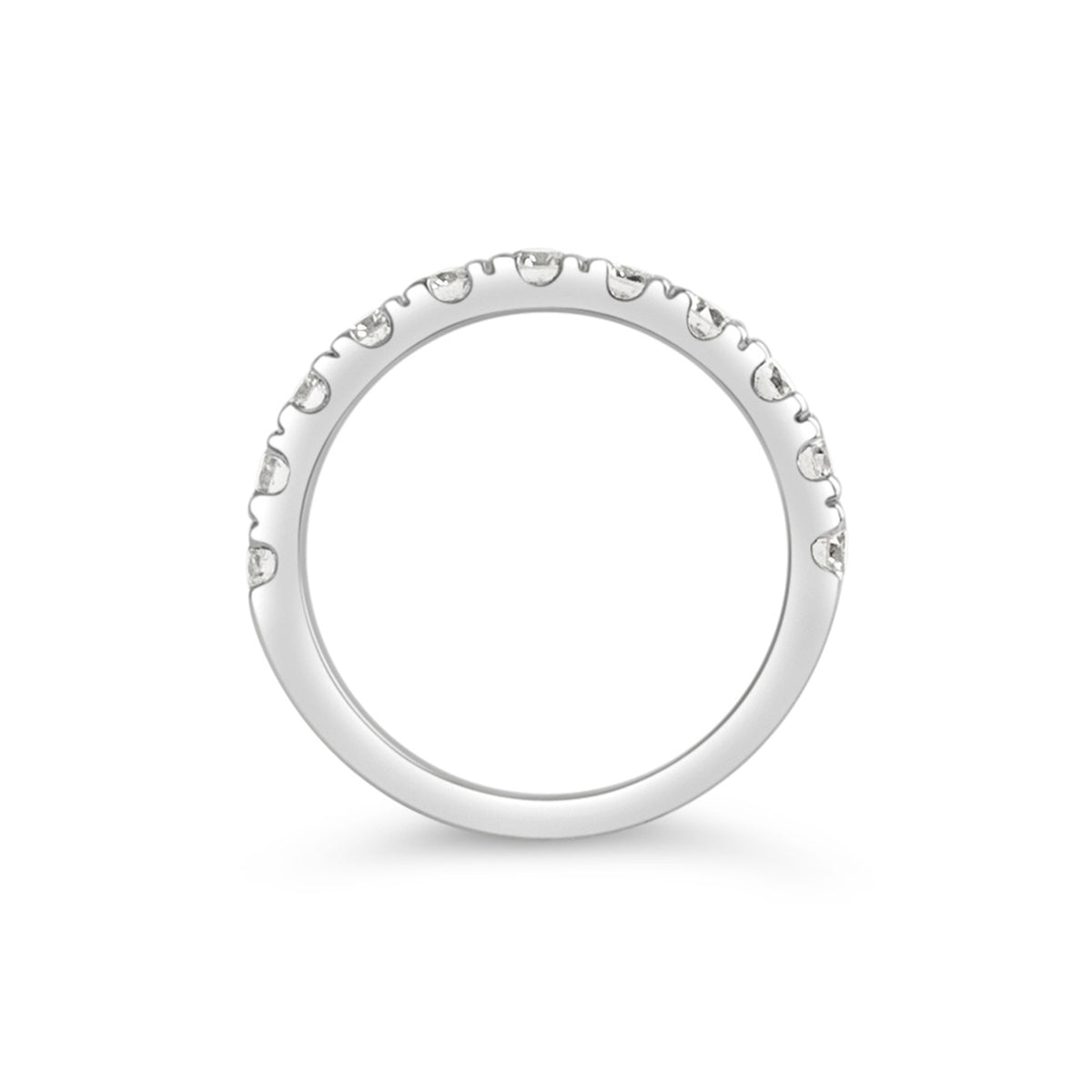 A top view of a four prong eternity band in white gold, highlighting the side profile of the beautiful diamonds.