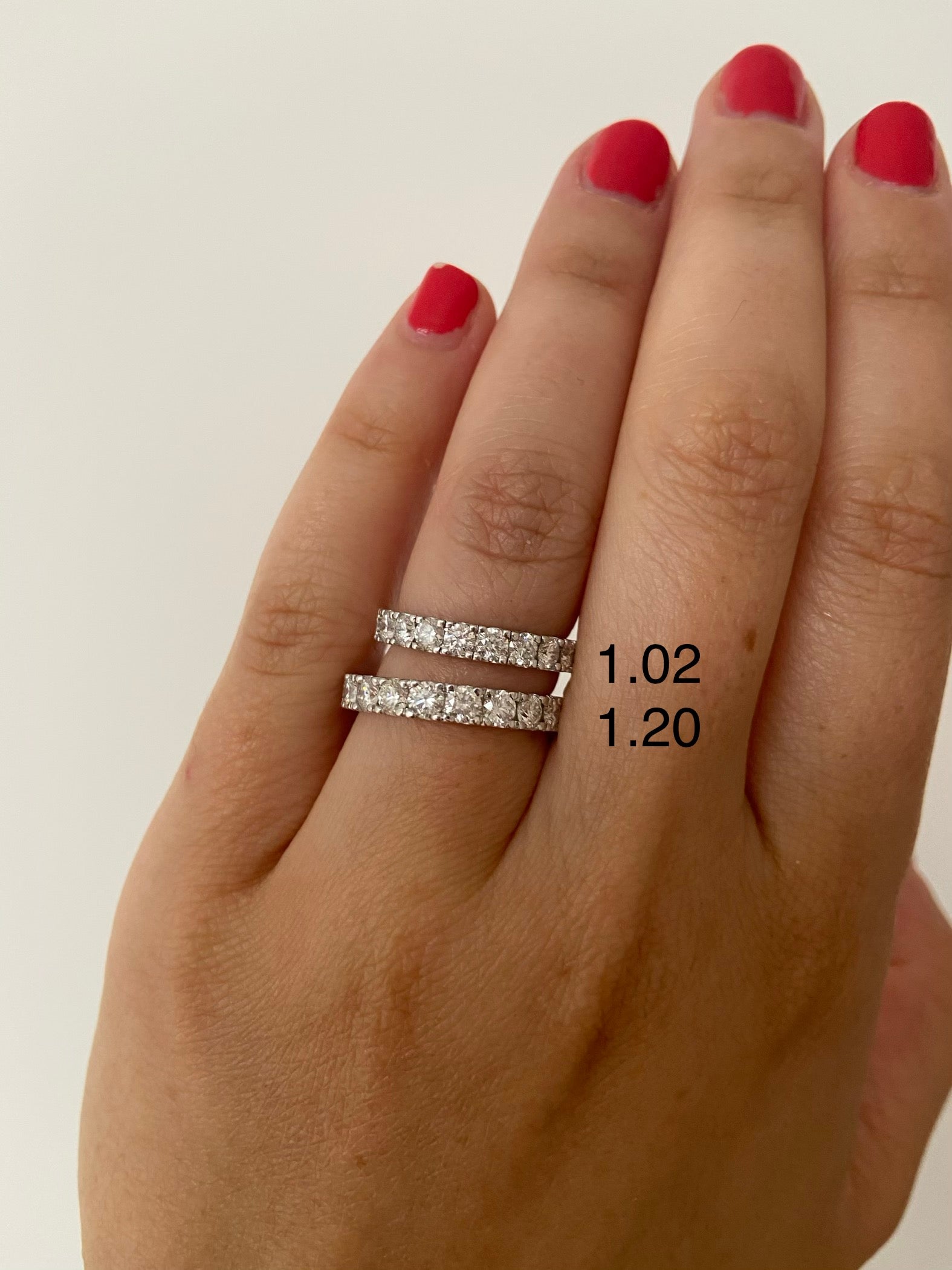 A woman's hand wearing two eternity