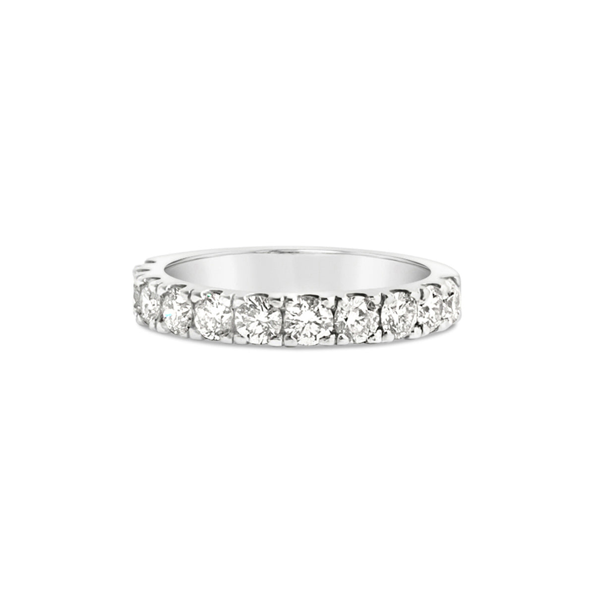 A four prong eternity band with a continuous row of round diamonds set in a white gold band, totaling 1.20 carats in weight, on a white background.