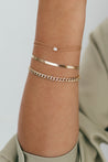 Sparkling diamond cut detail on puffy curb bracelet for a luxurious look.