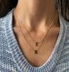Luxurious Gothic Initial Curb Necklace on model, perfect for layering.