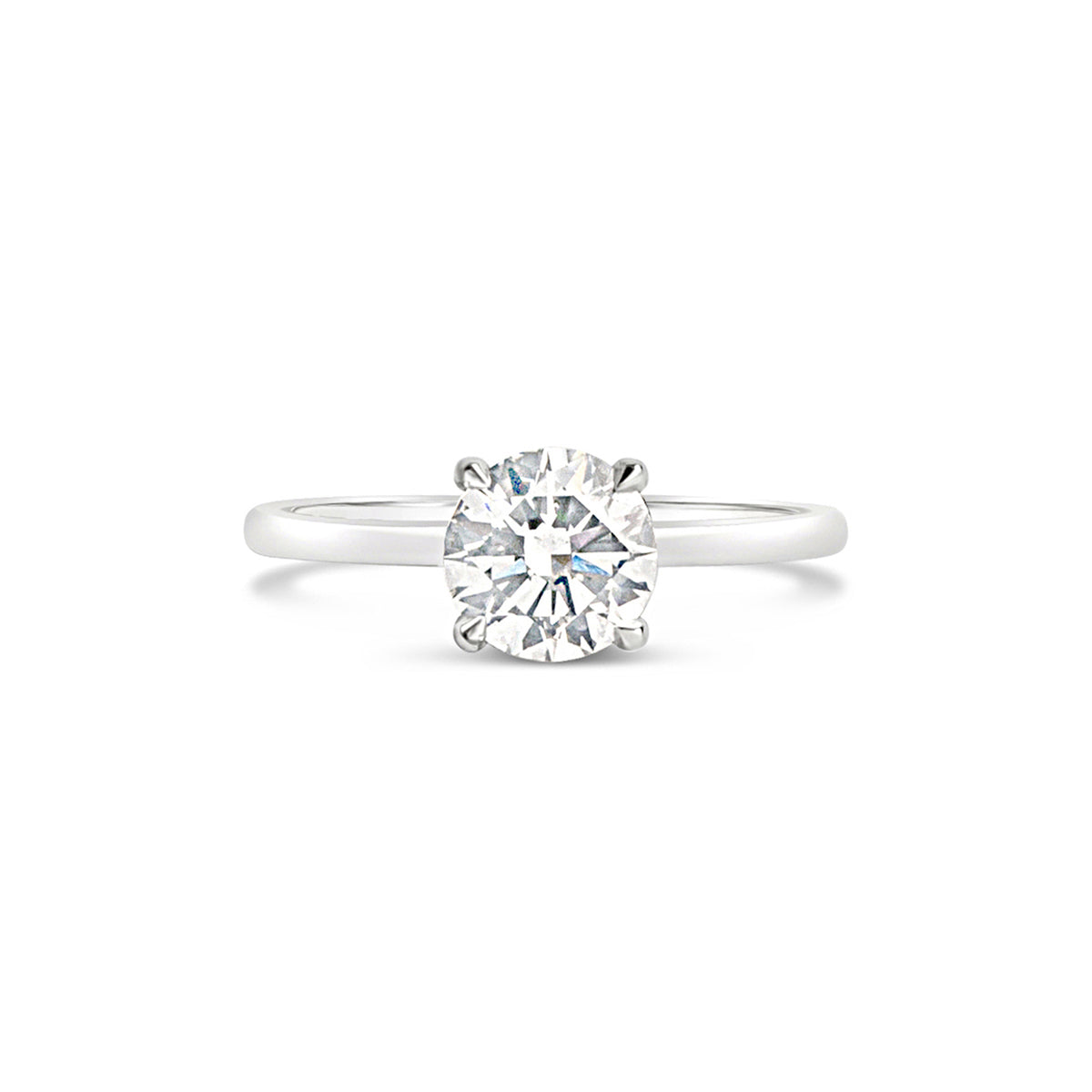 A solitaire engagement ring featuring a hand-picked center diamond with a hidden halo of small diamonds hidden just beneath the main stone.