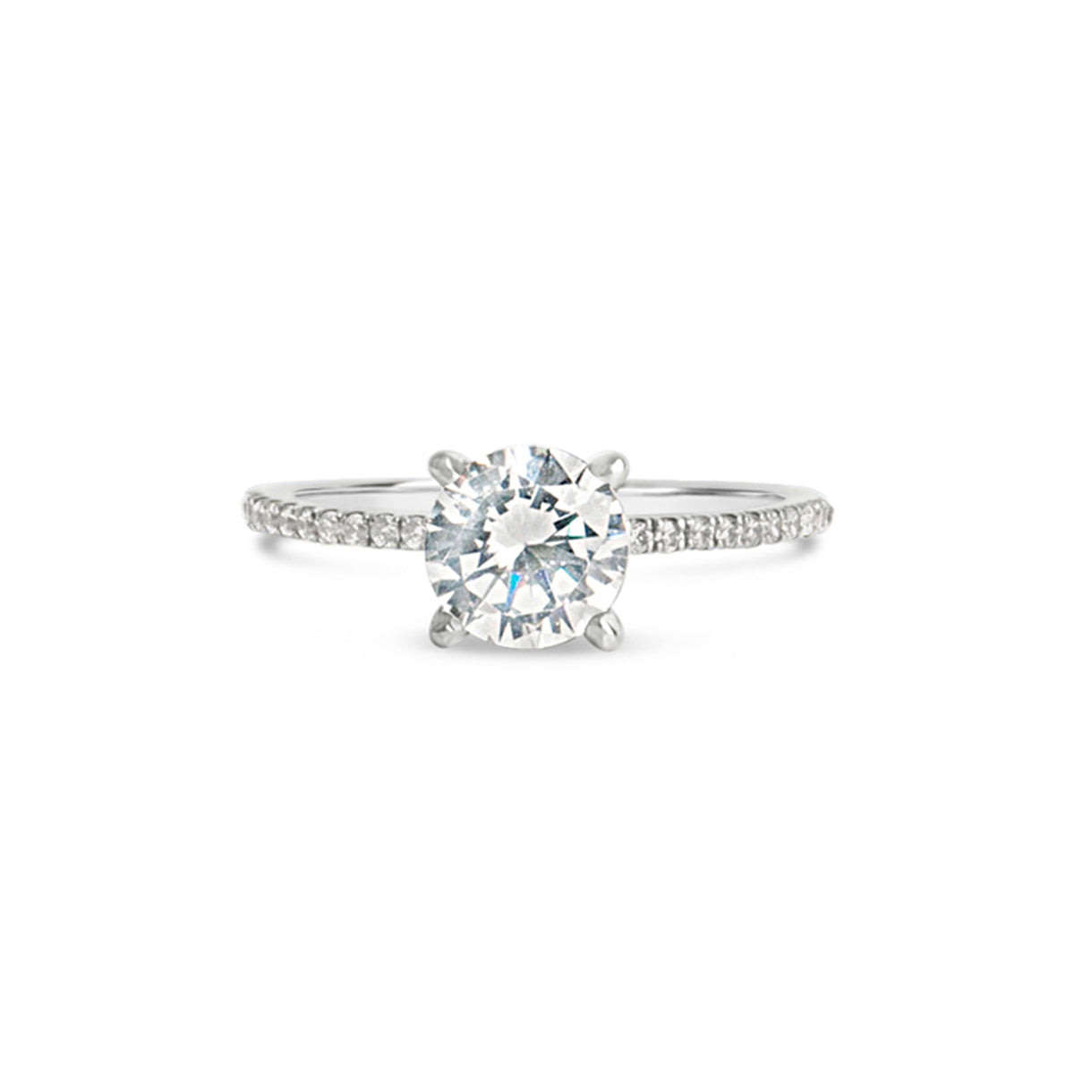 A solitaire engagement ring featuring tiny diamonds around the band, designed to highlight the center stone.