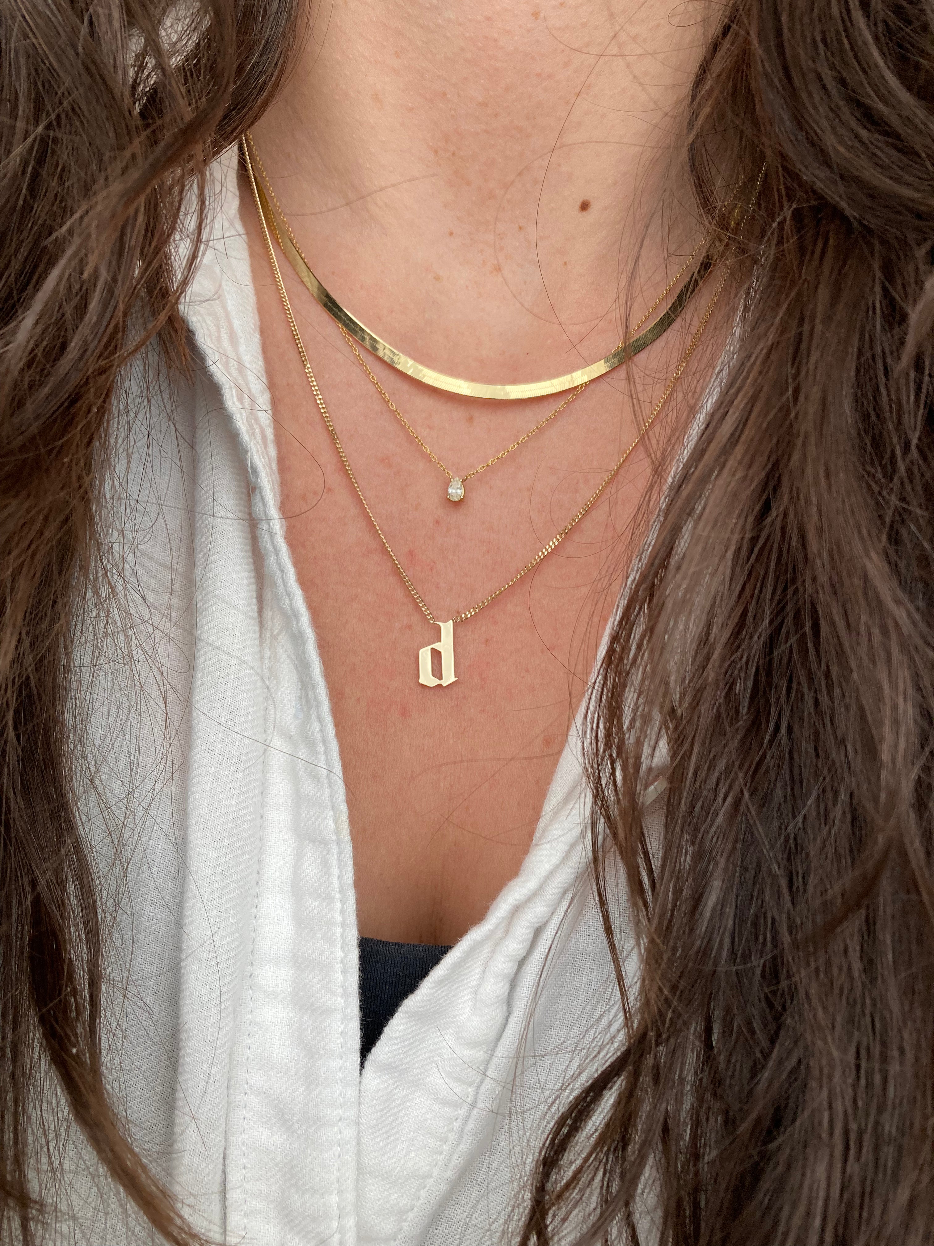 Statement Gothic Initial pendant on a thick curb chain.