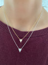 Jessica Jewellery's pointy diamond heart necklace sparkling under light.