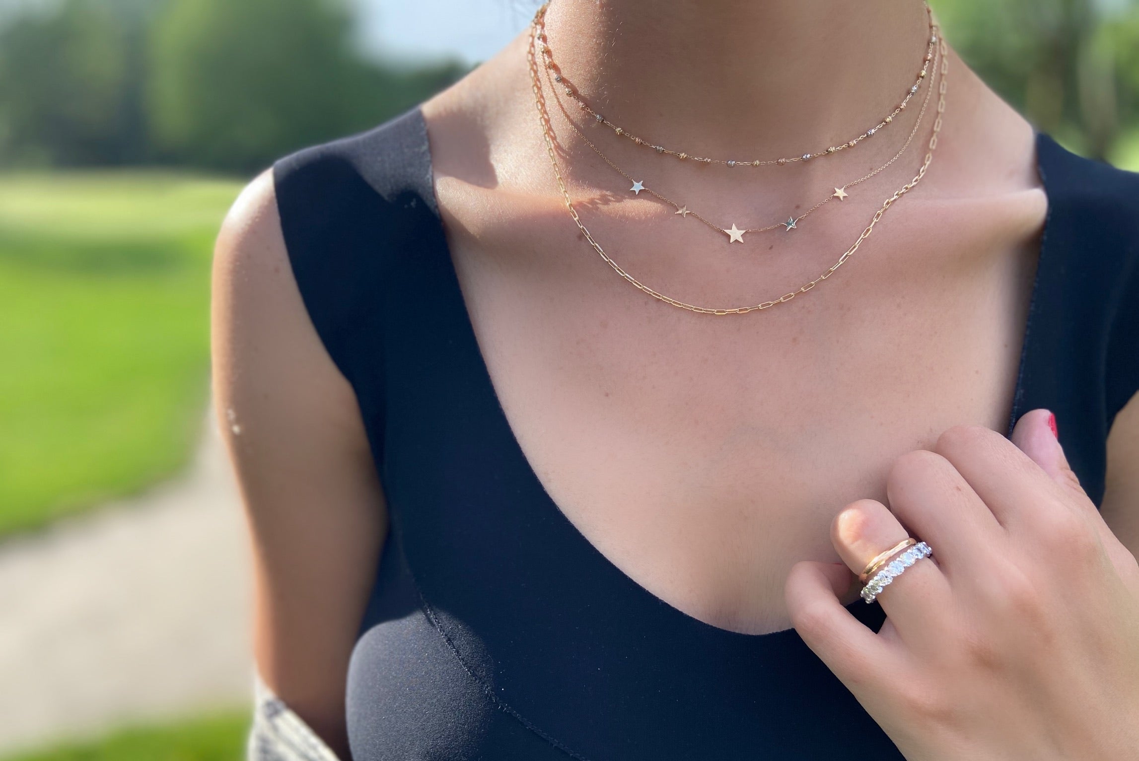 Close-up of the Petite Star Necklace, perfect for layering or solo wear